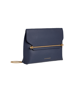 A blue purse with a gold handle