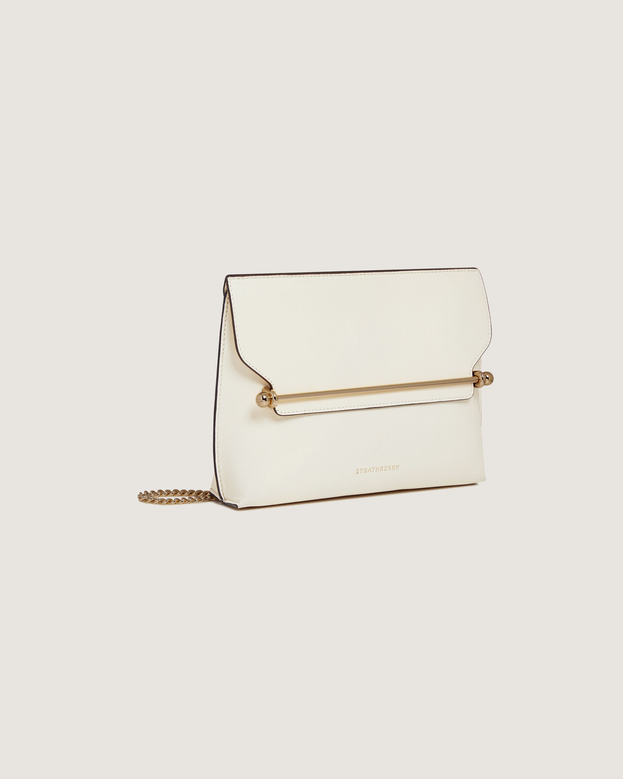 A white clutch bag with a gold chain