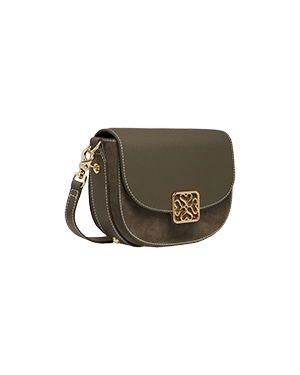 A brown cross body bag on a green background