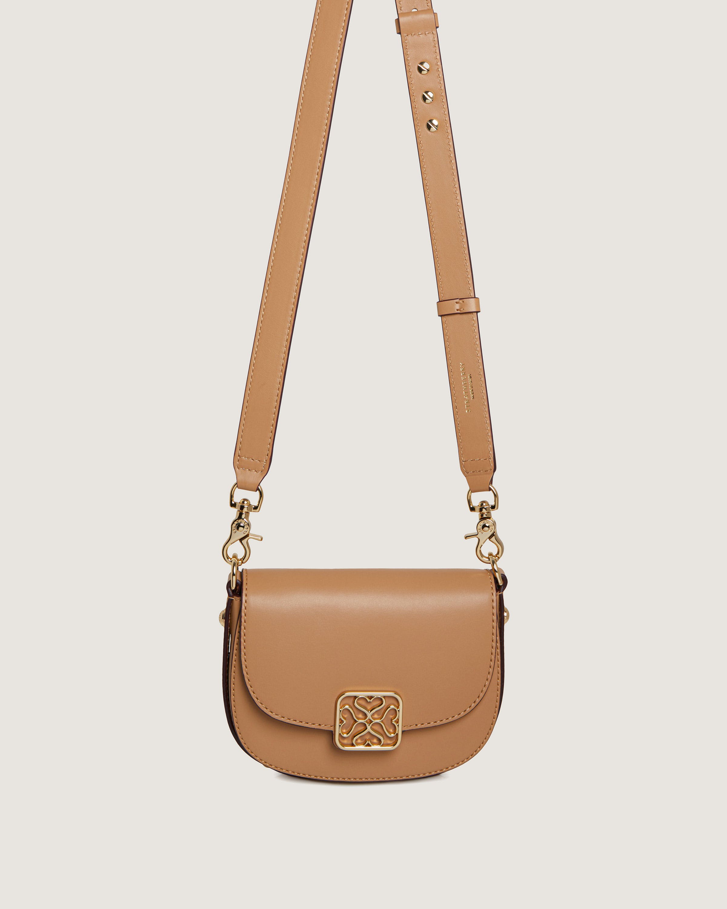 A tan purse with a chain strap