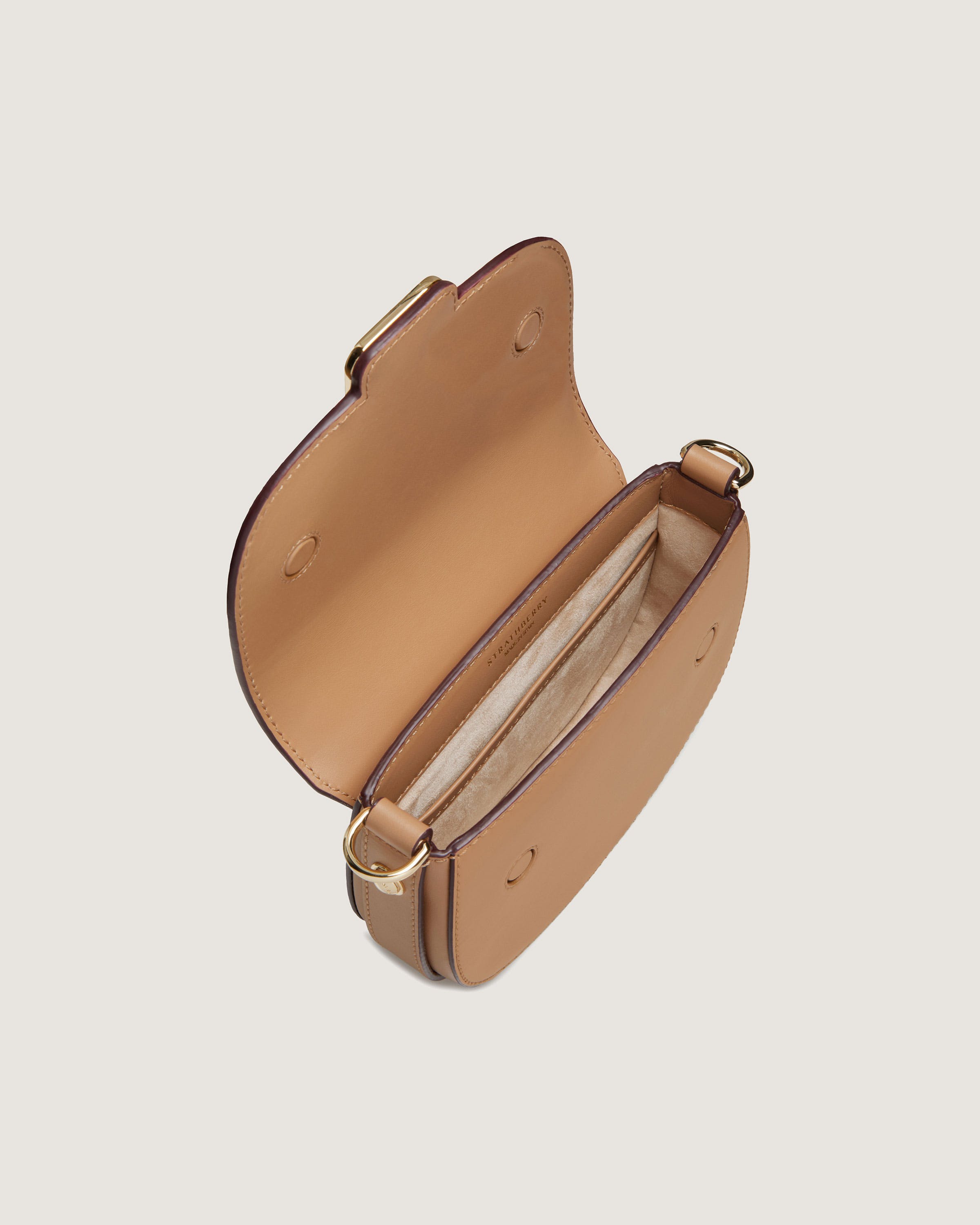 A small tan leather purse with a handle