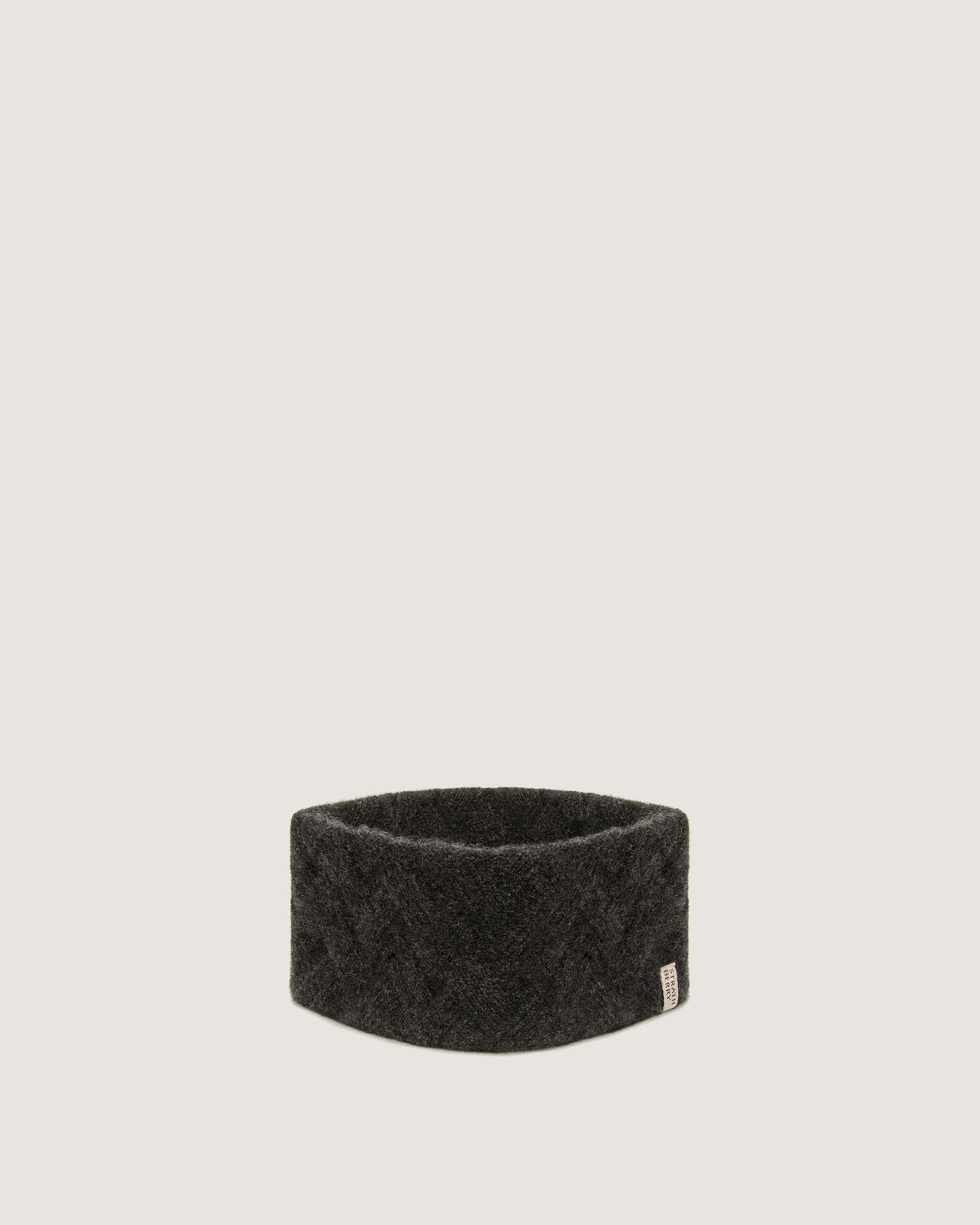 A black headband on a white background