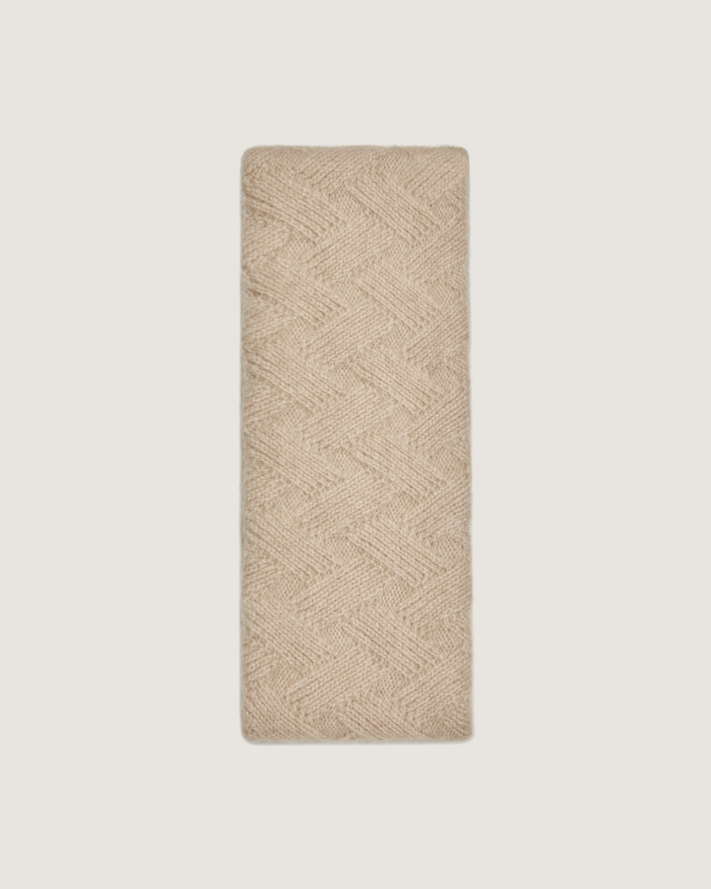 A beige towel on a white background