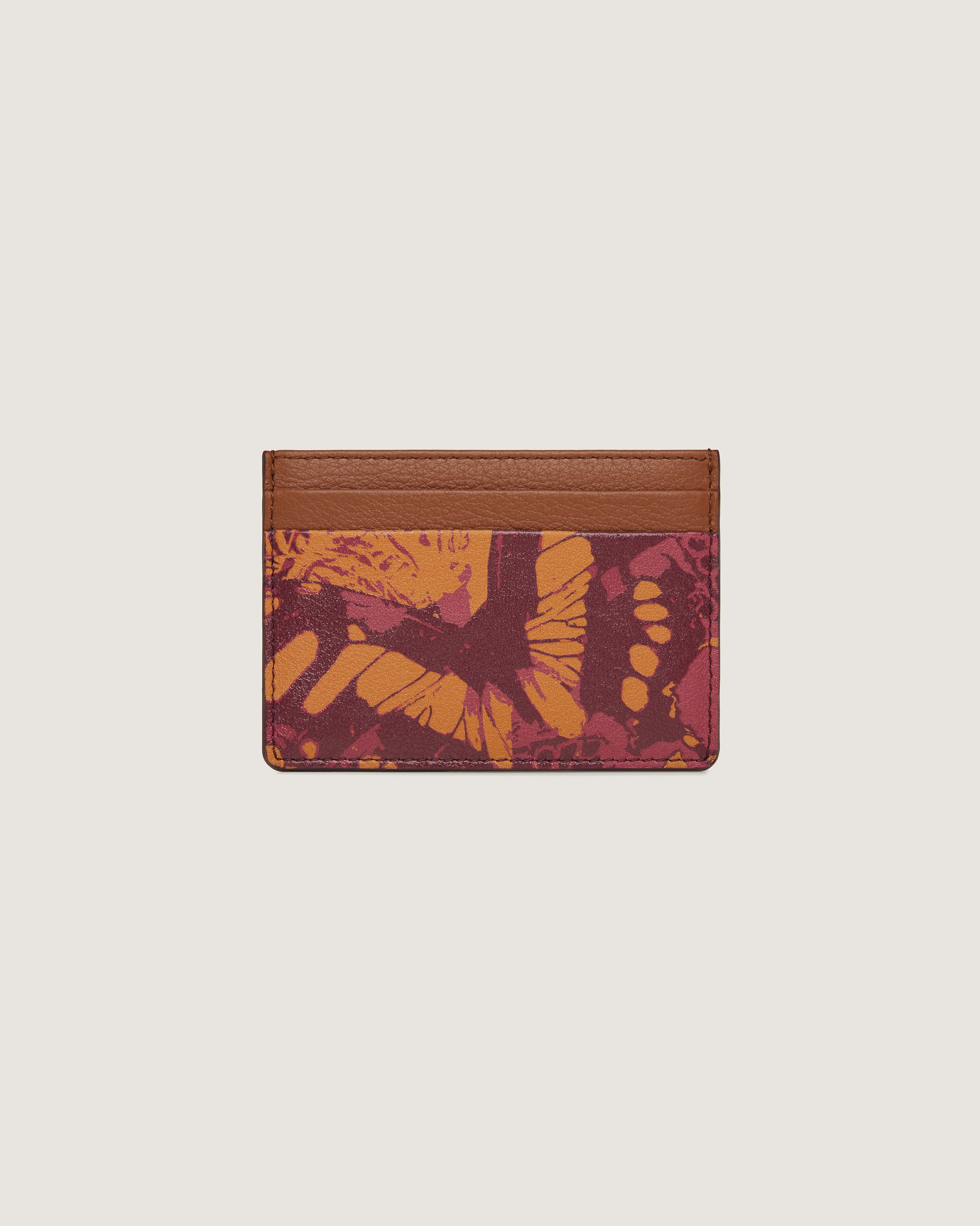 A card case with an orange and yellow design