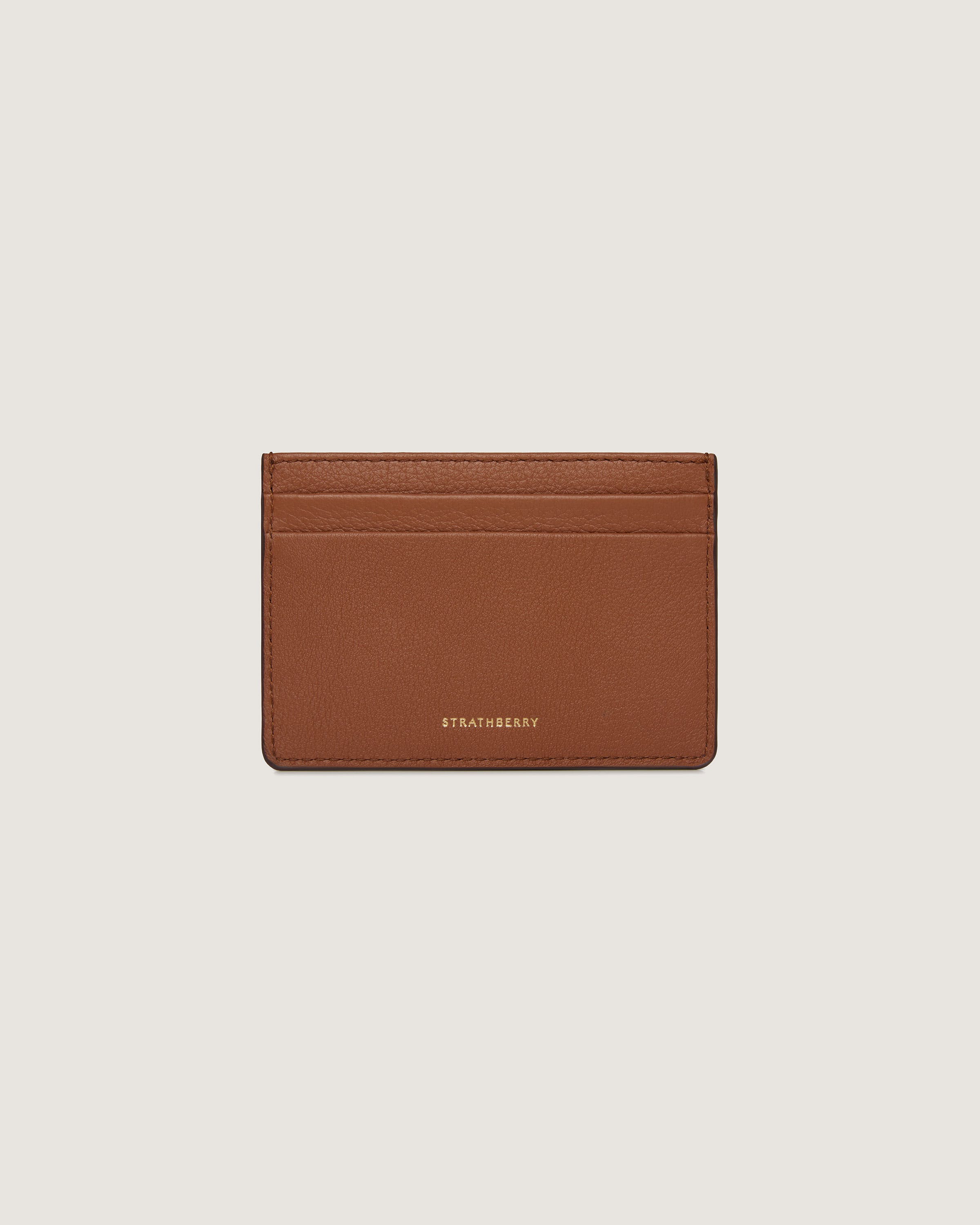 A brown card case on a white background