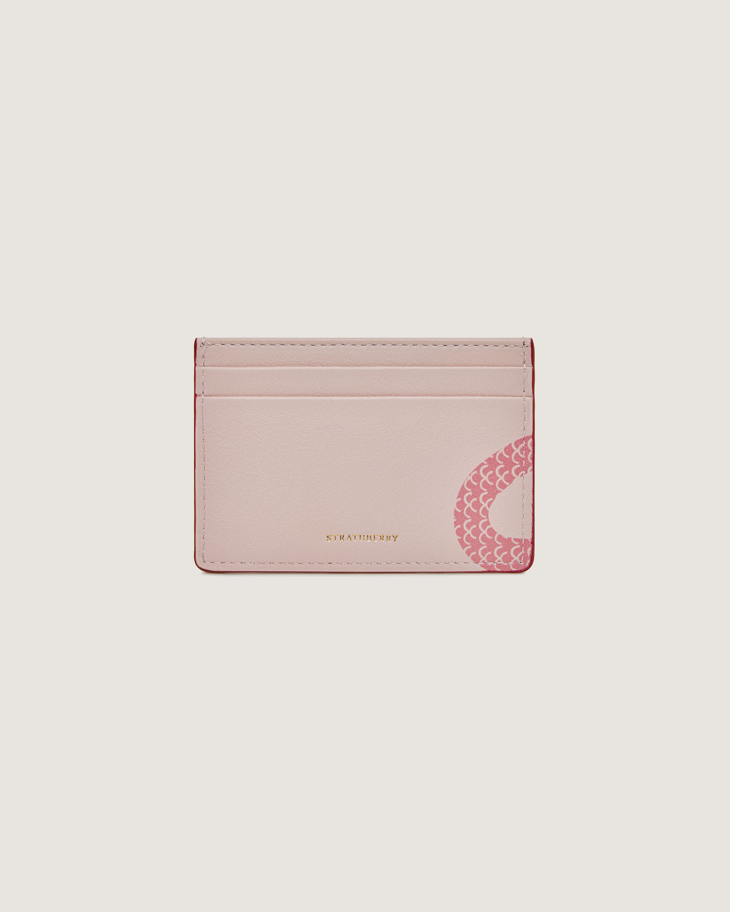 A pink card case on a white background