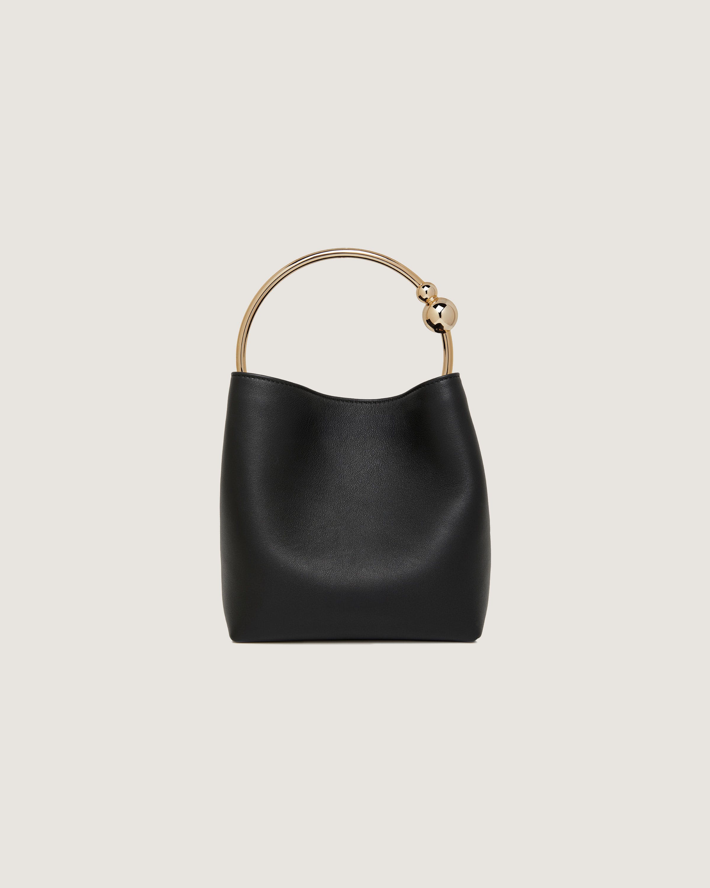 A black handbag with a gold handle