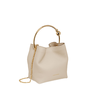 A white handbag with a gold handle