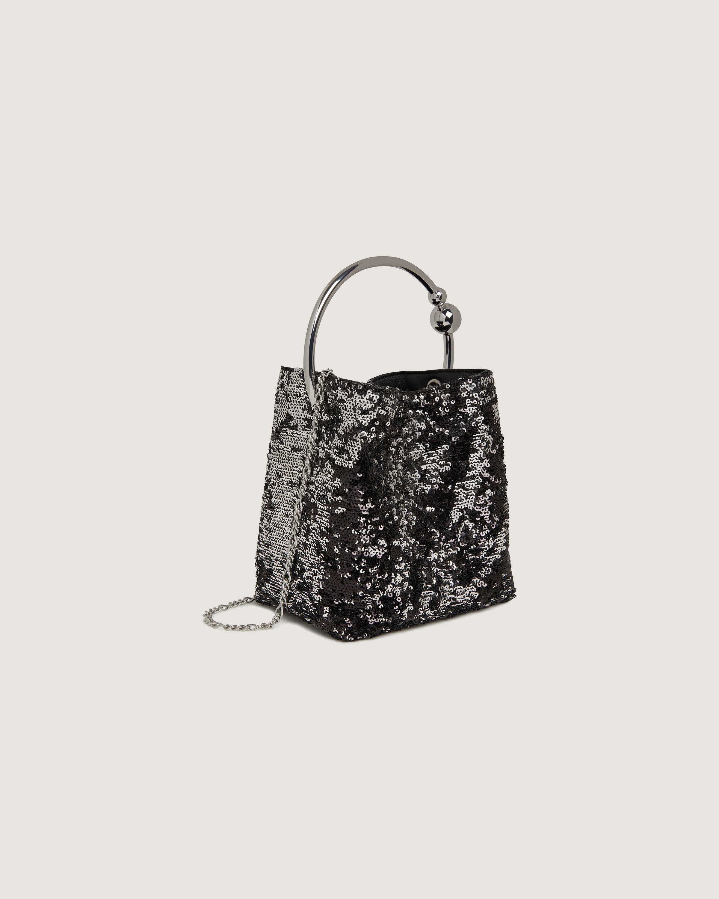 A black and silver handbag on a white background