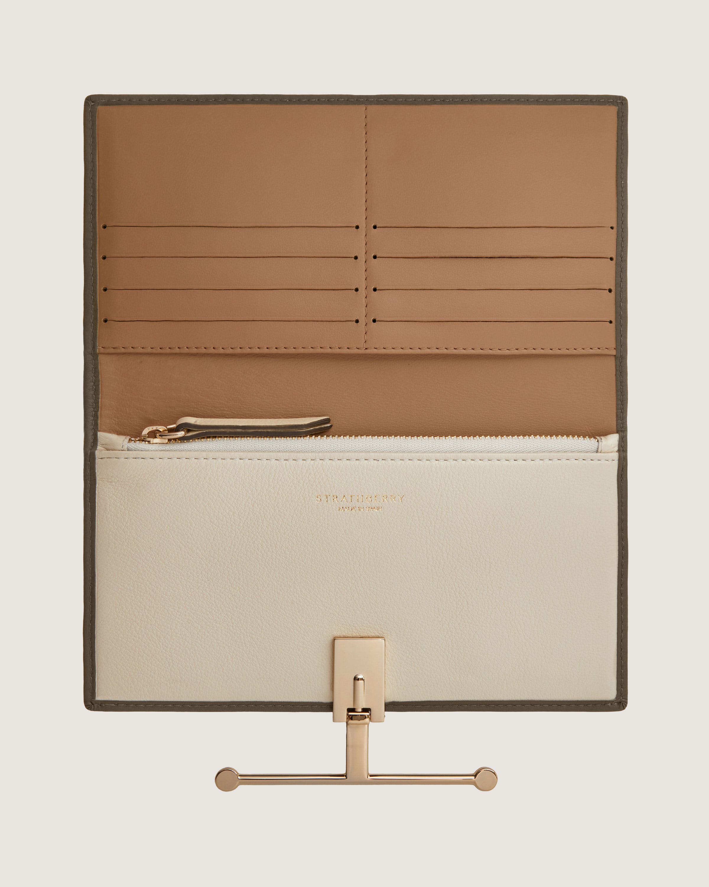 A white and tan purse with a card holder