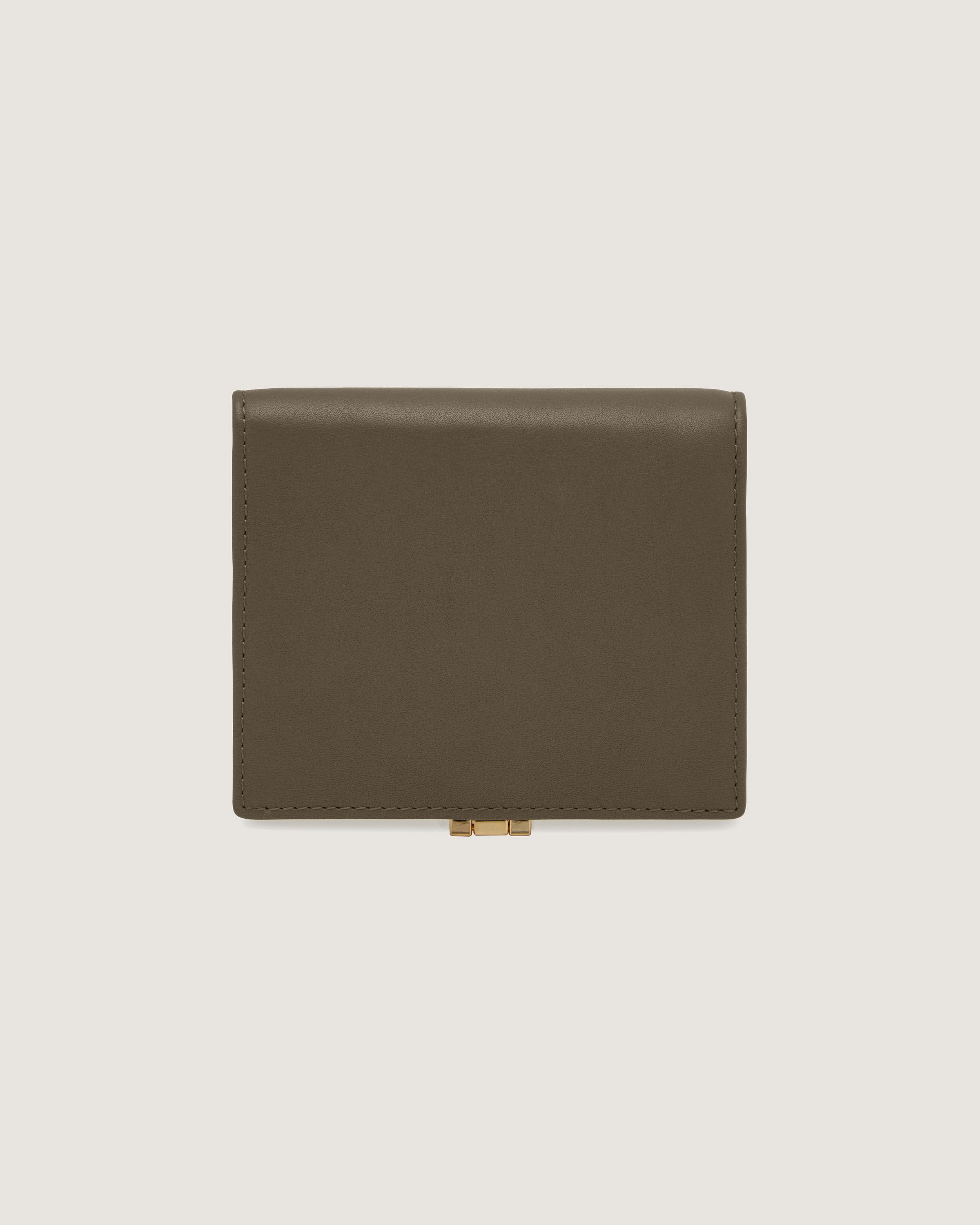 A brown leather wallet on a white background