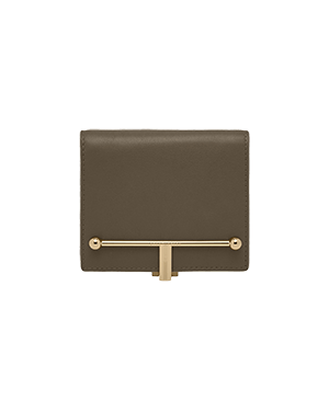 A brown wallet with a gold bar on the front