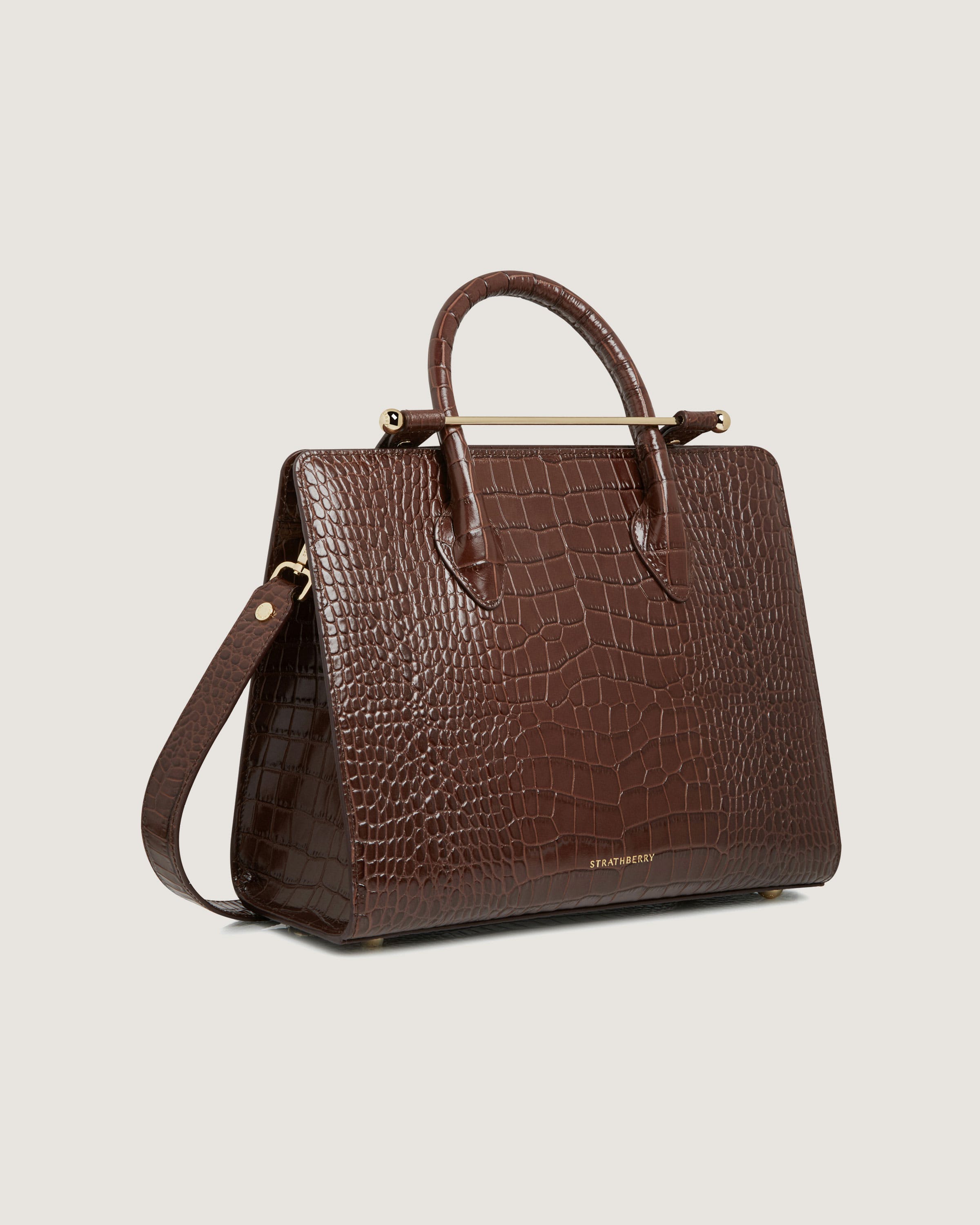 A brown handbag on a white background