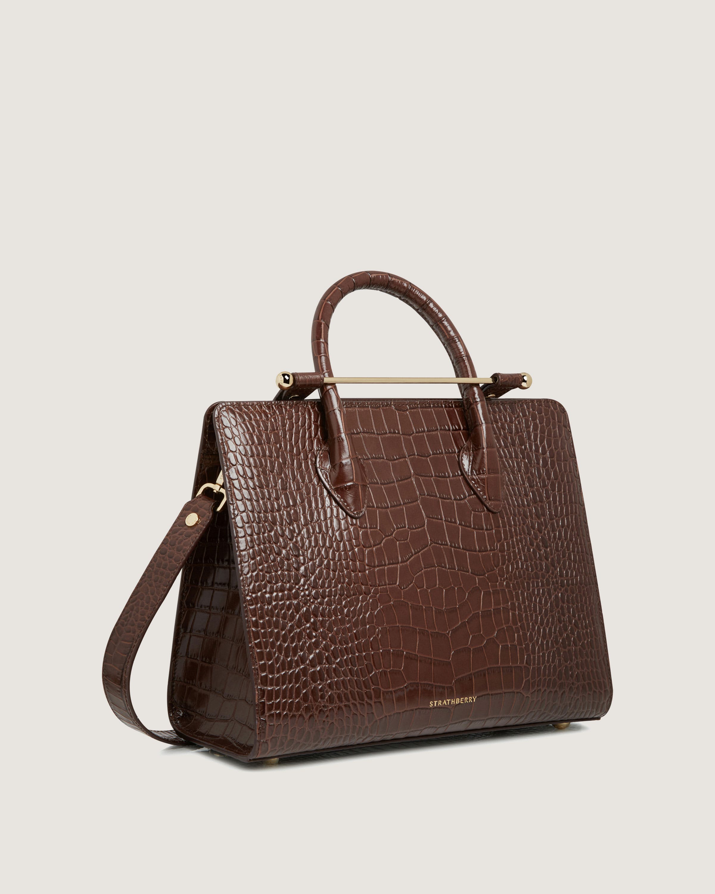 A brown handbag on a white background