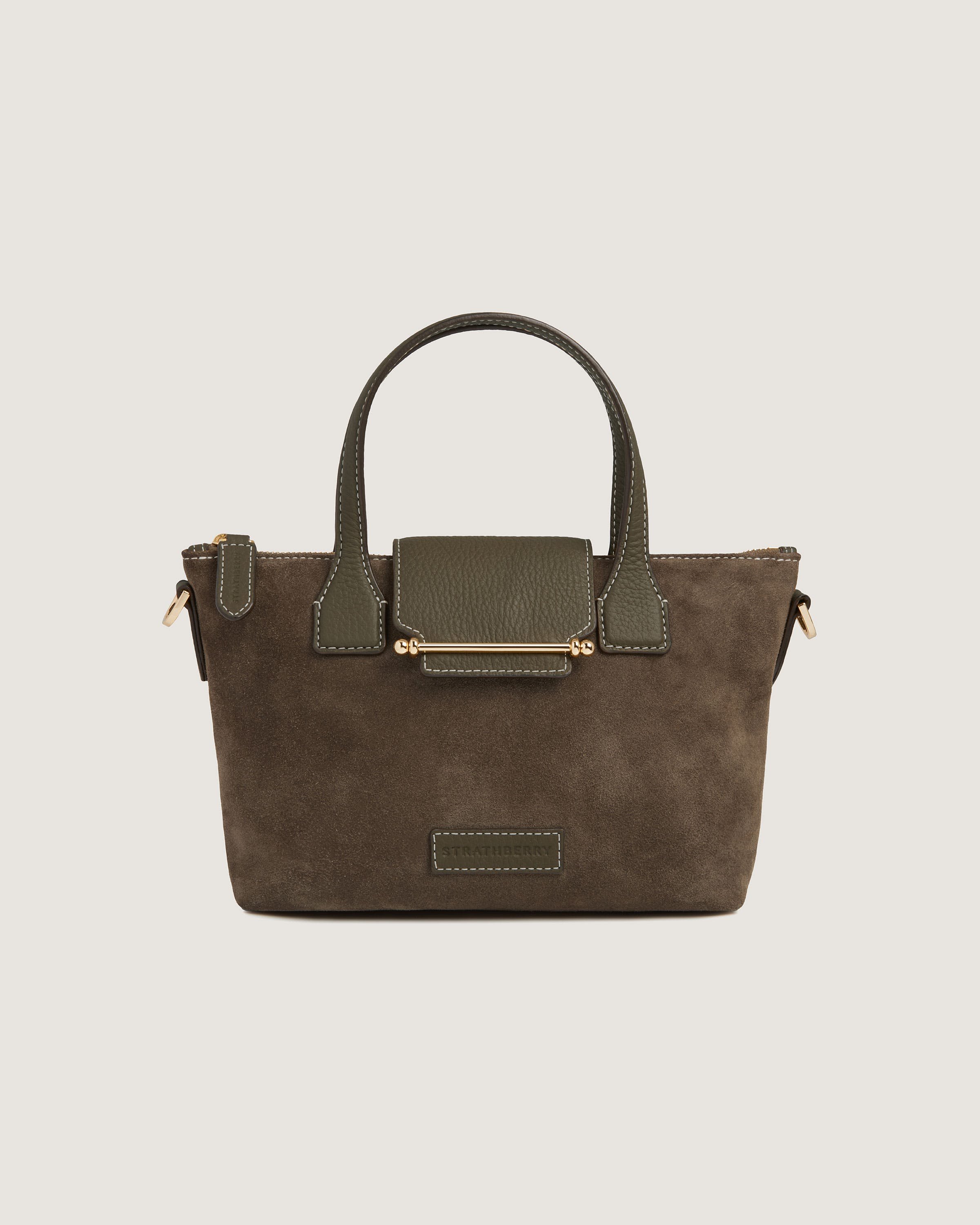 A brown handbag with a handle and two handles