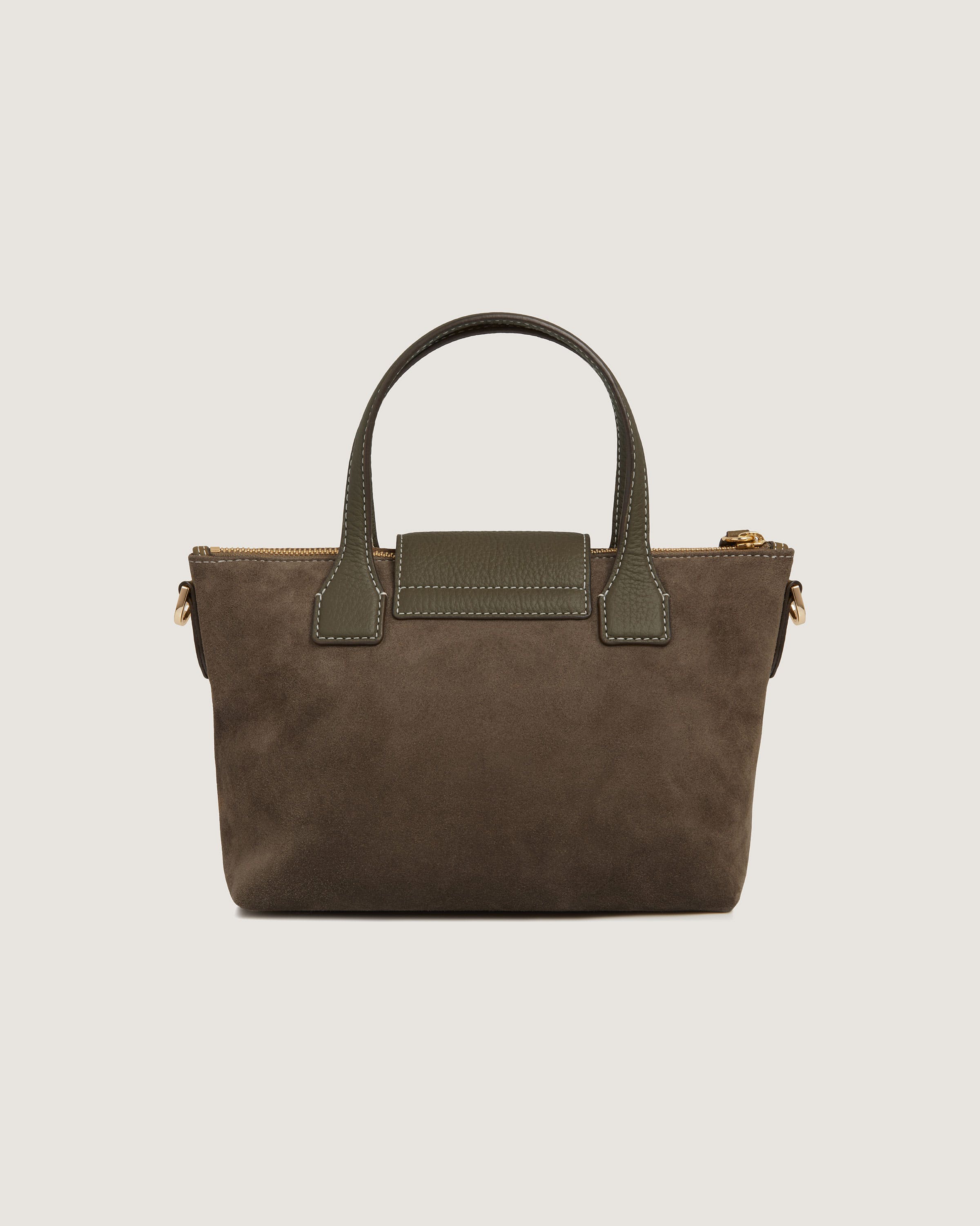 A brown handbag with a handle on a white background