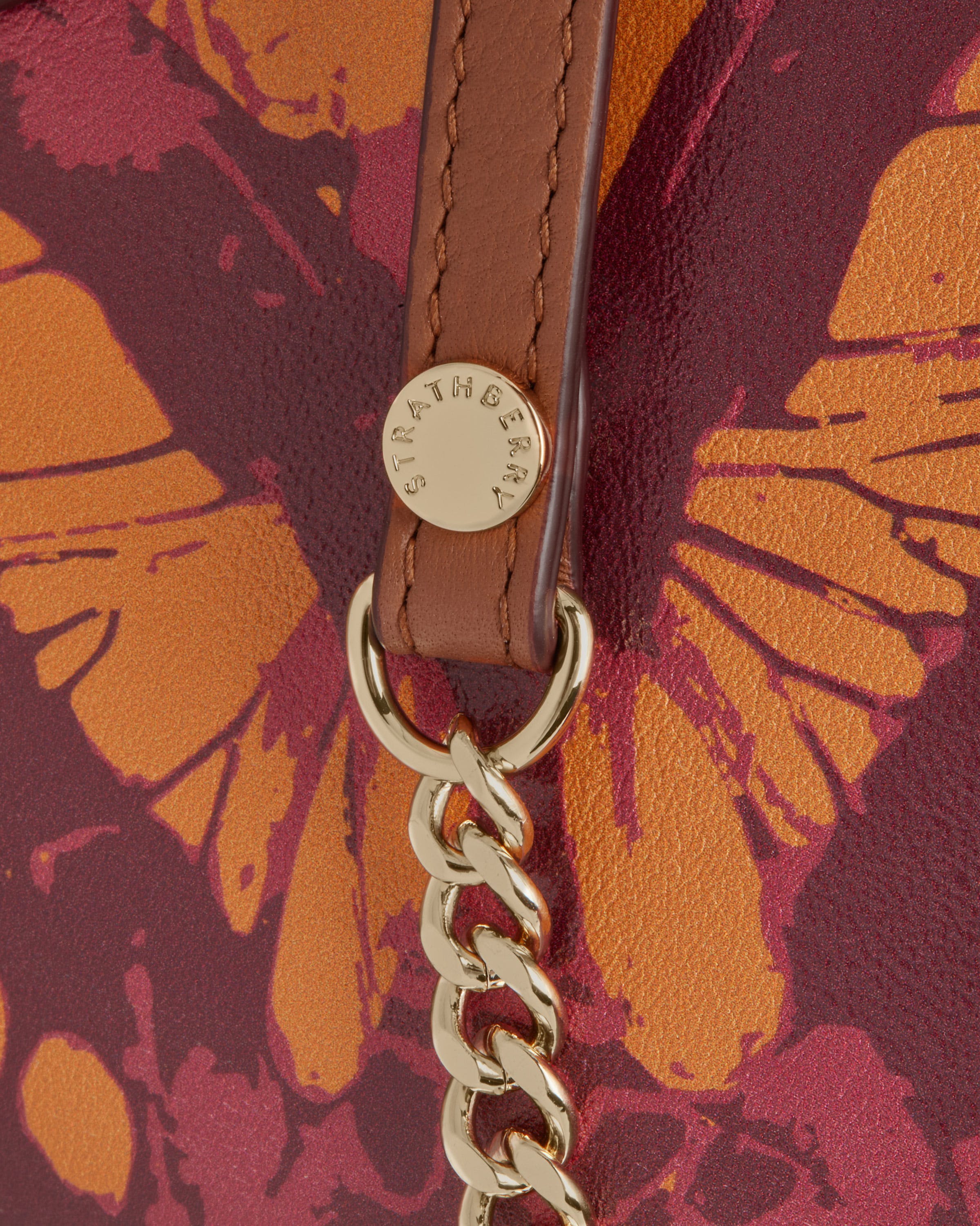 A close up of a purse with a chain on it