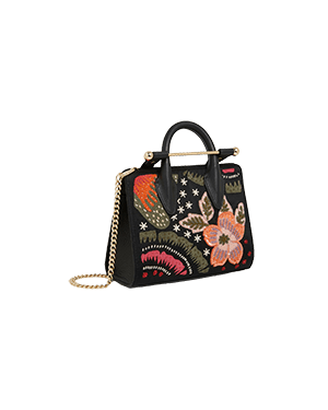 A handbag with a flower design on it