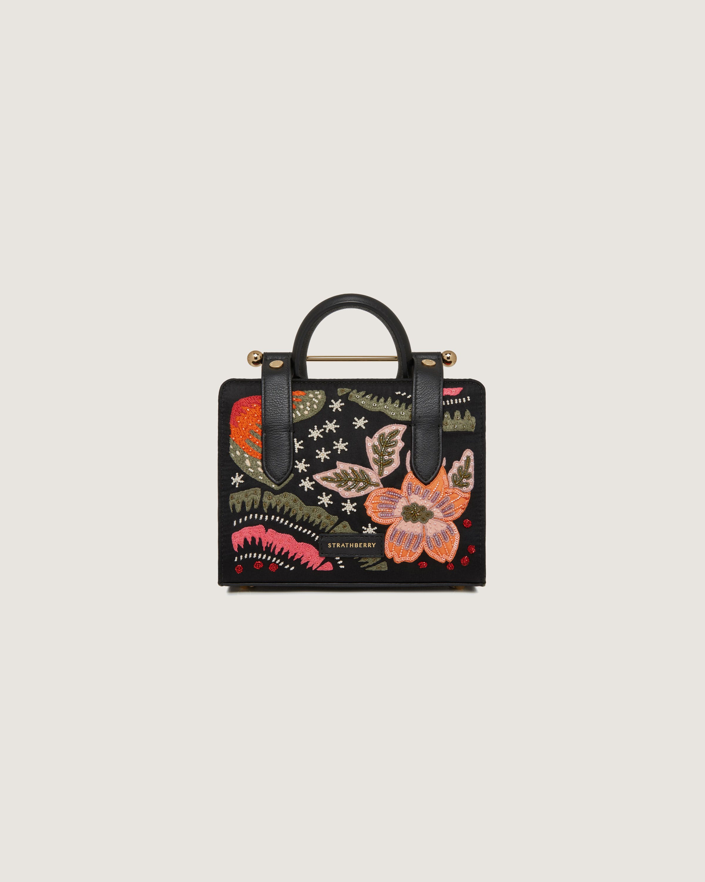 A handbag with a floral pattern on it