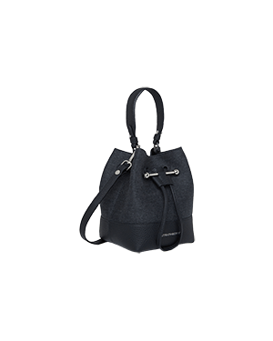 A black handbag on a green background