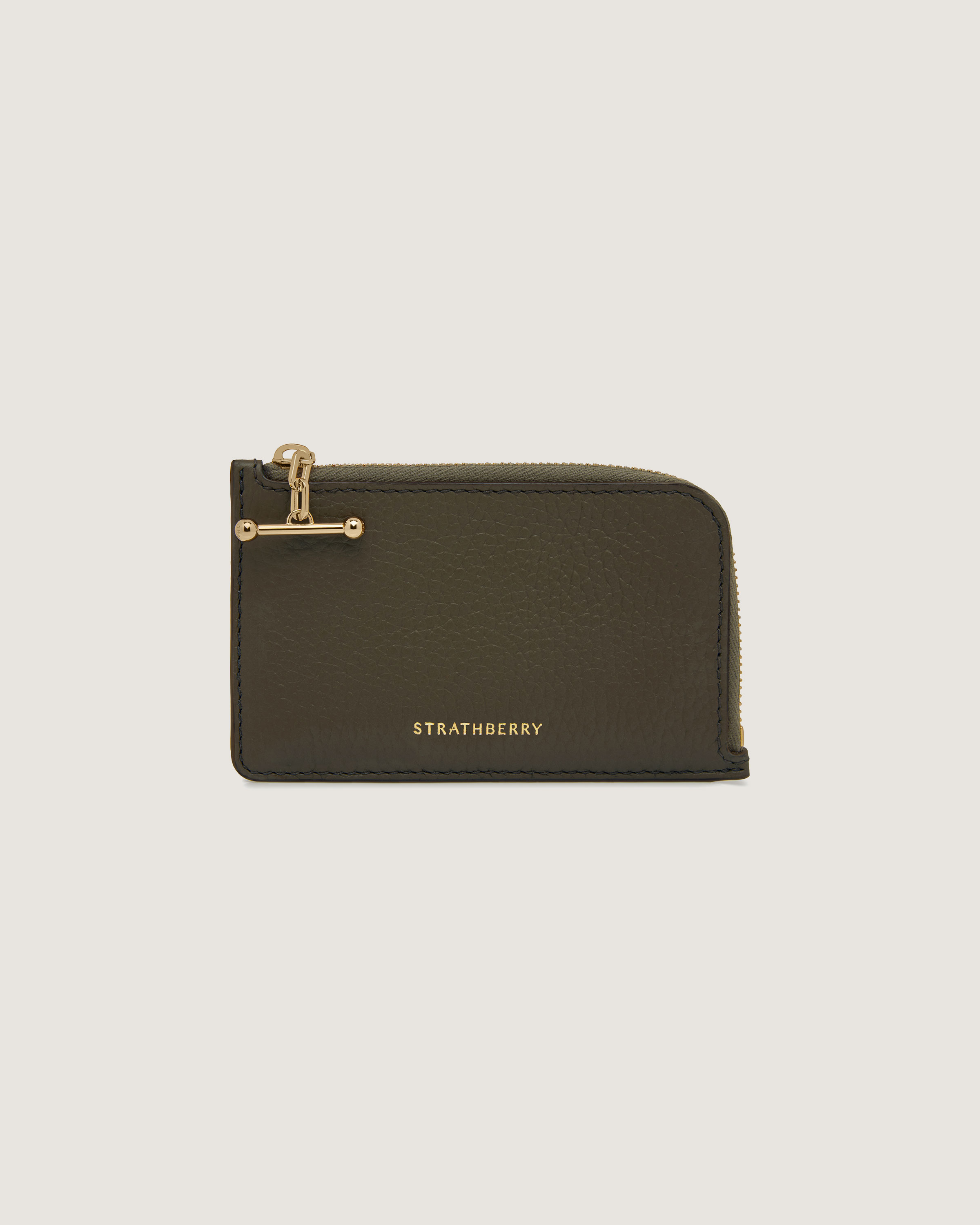 A green leather wallet with a gold zipper