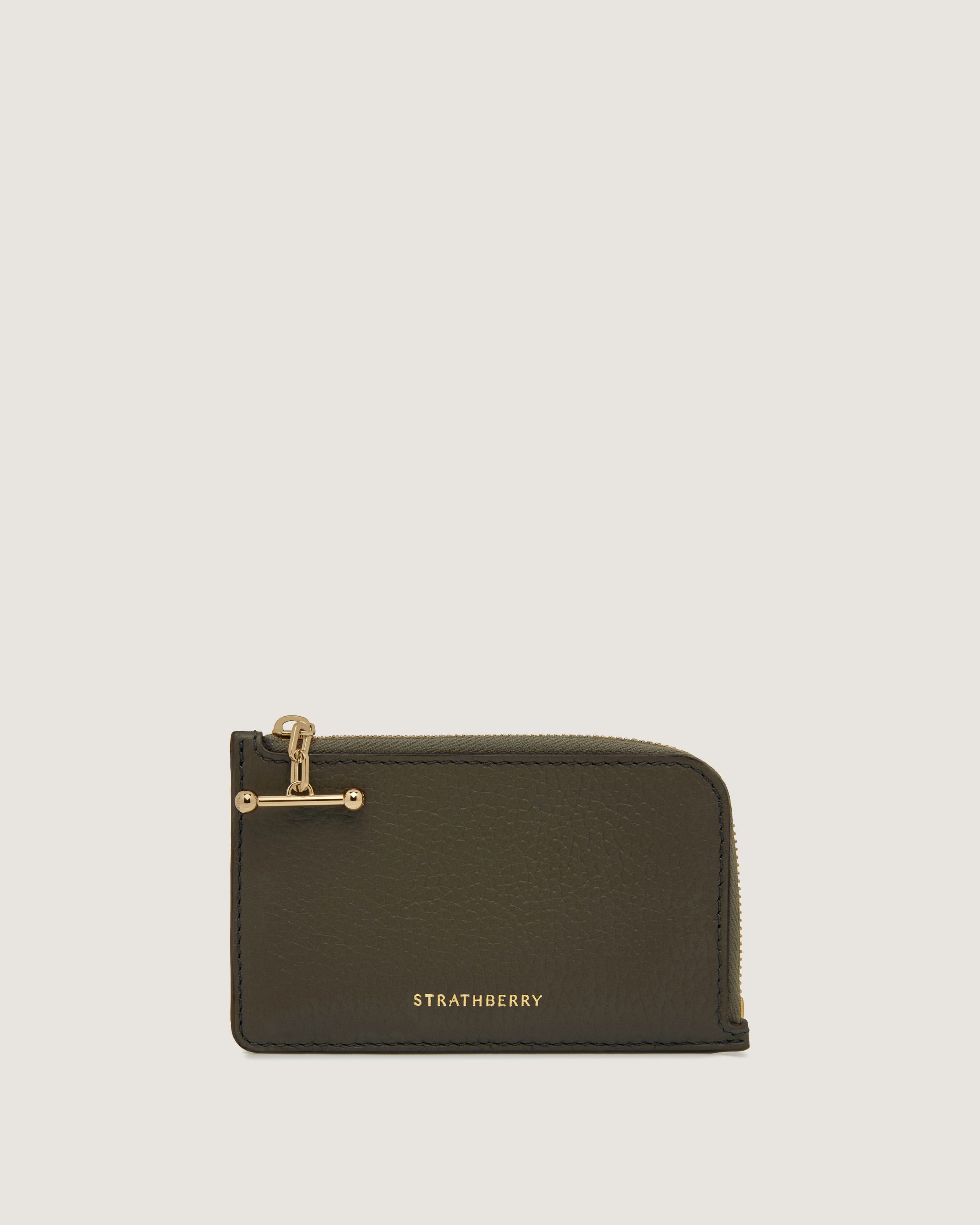 A green leather wallet with a gold clasp