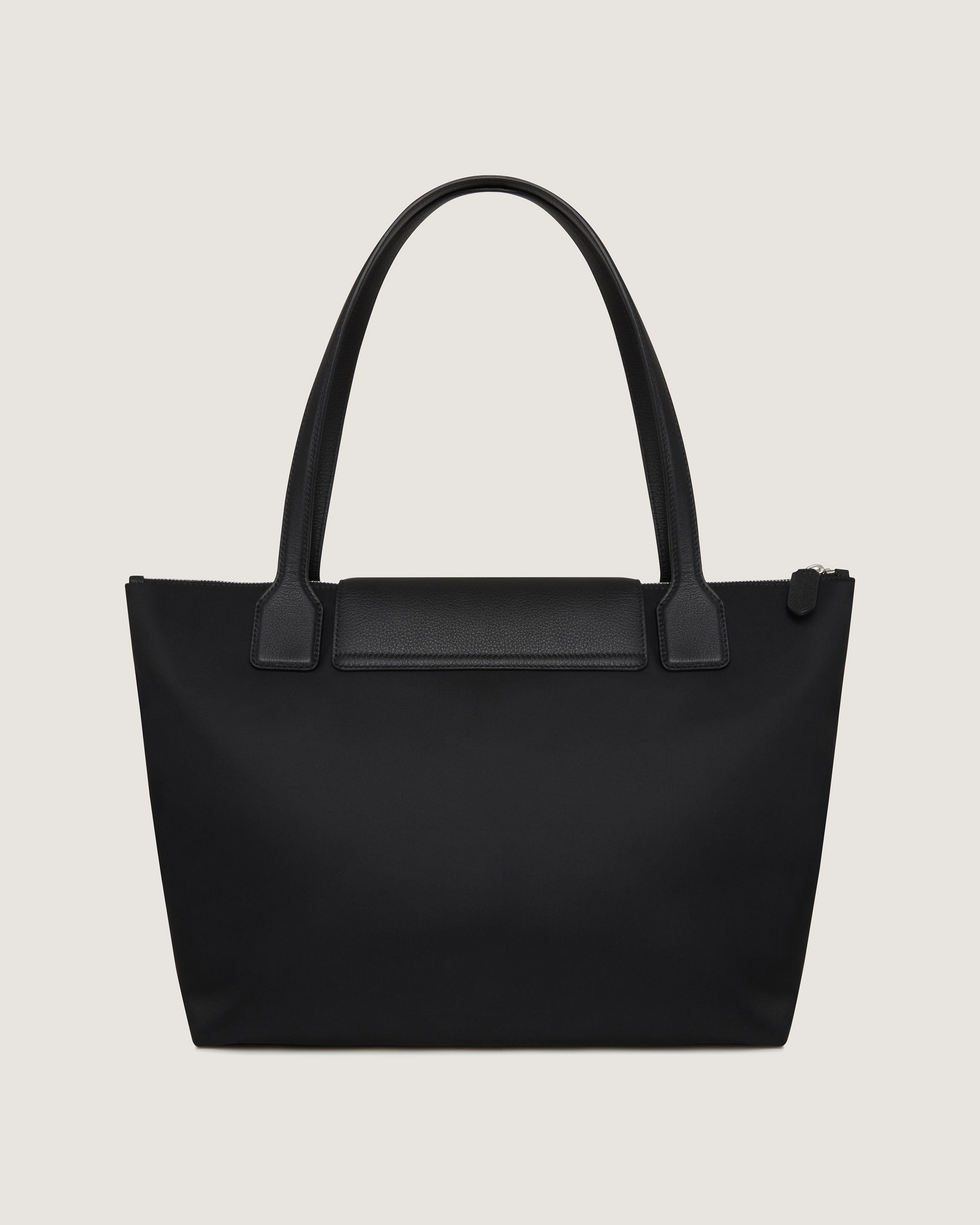 A black tote bag on a white background