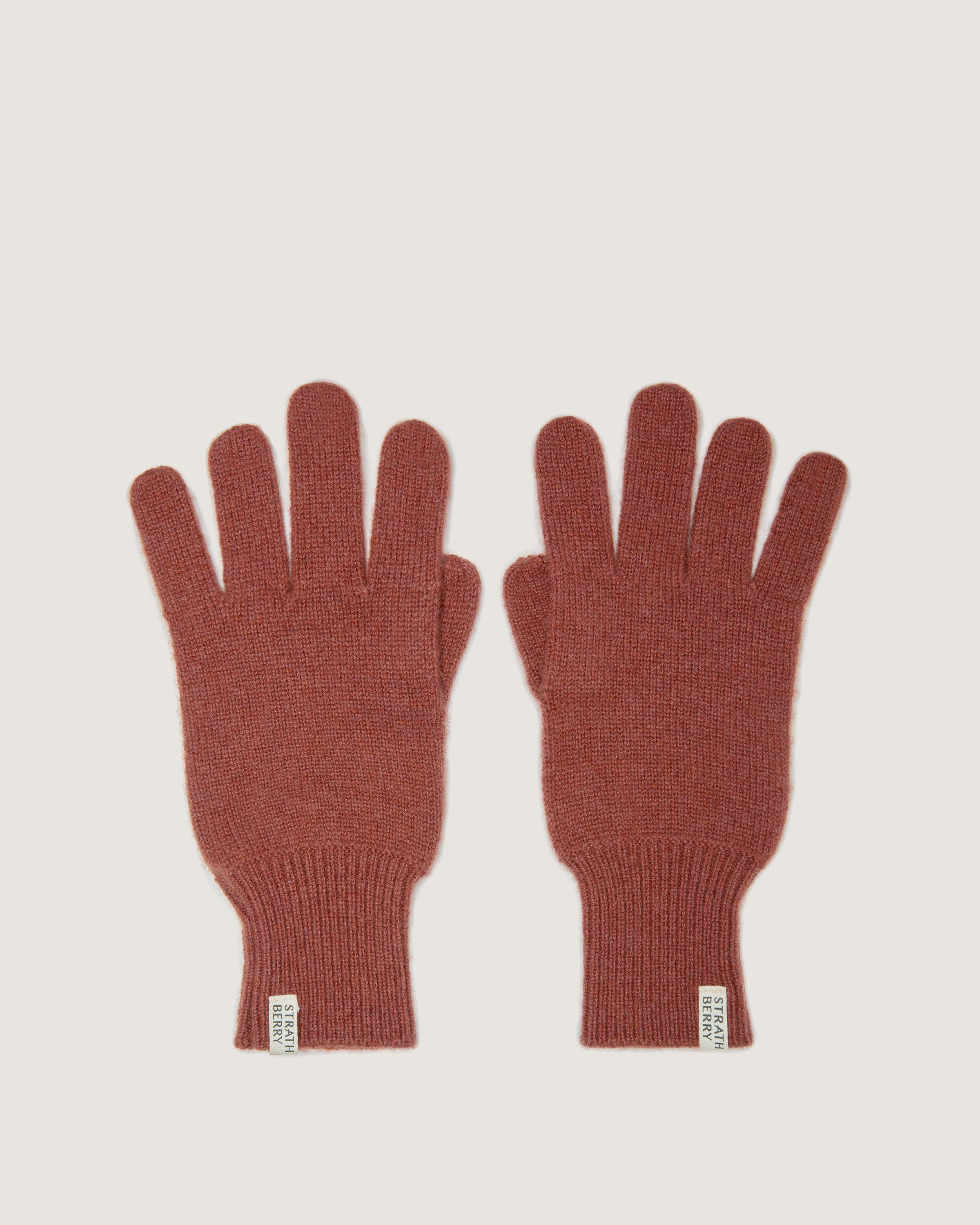 A pair of red gloves on a white background