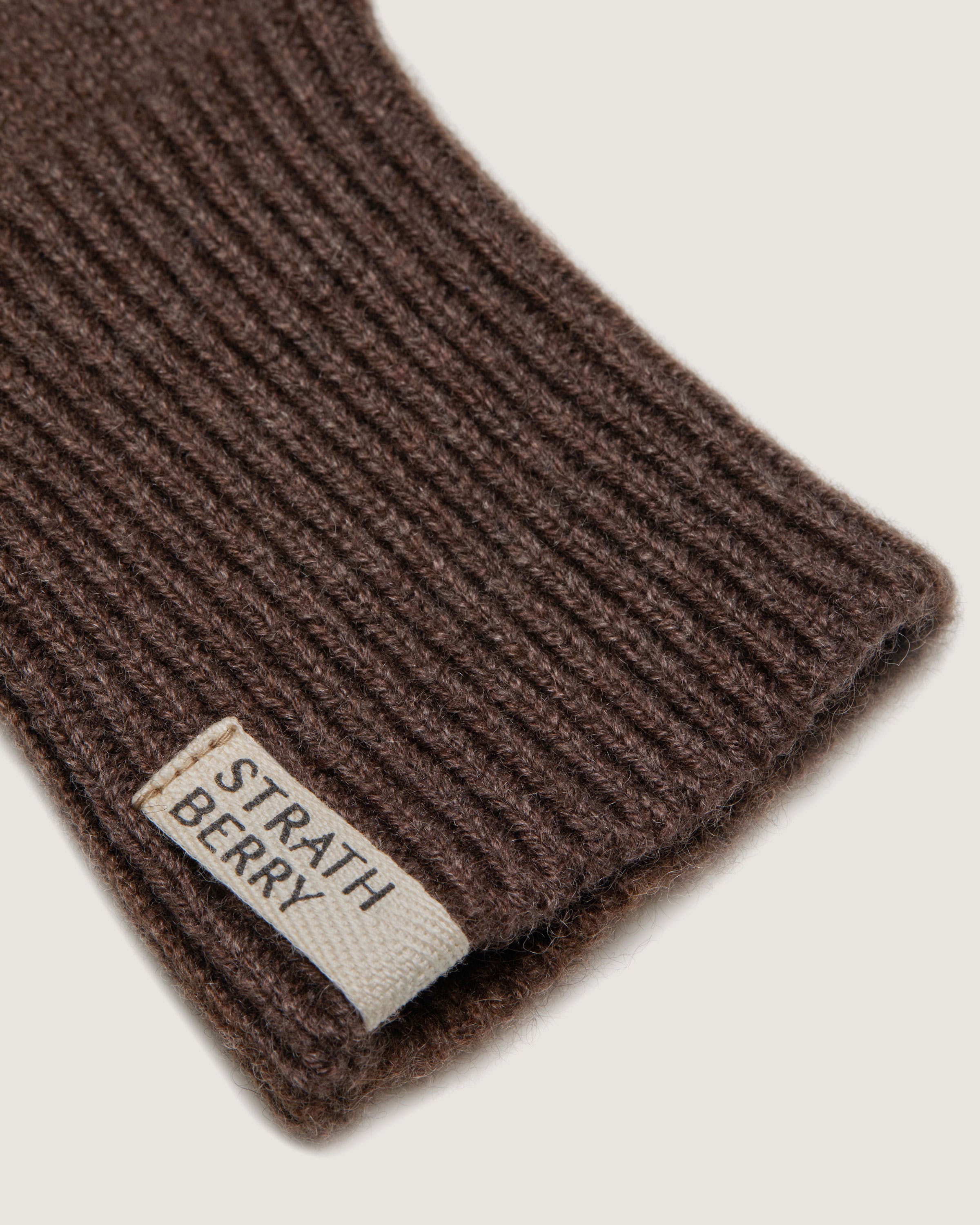 A brown hat with a white label on it