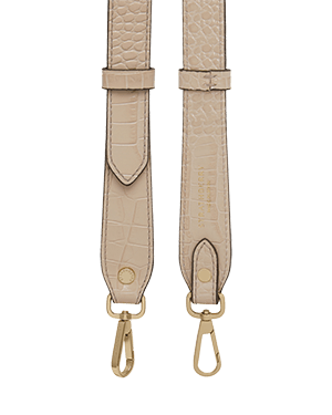 A beige strap with a gold buckle