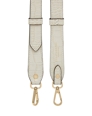 A white strap with a gold buckle