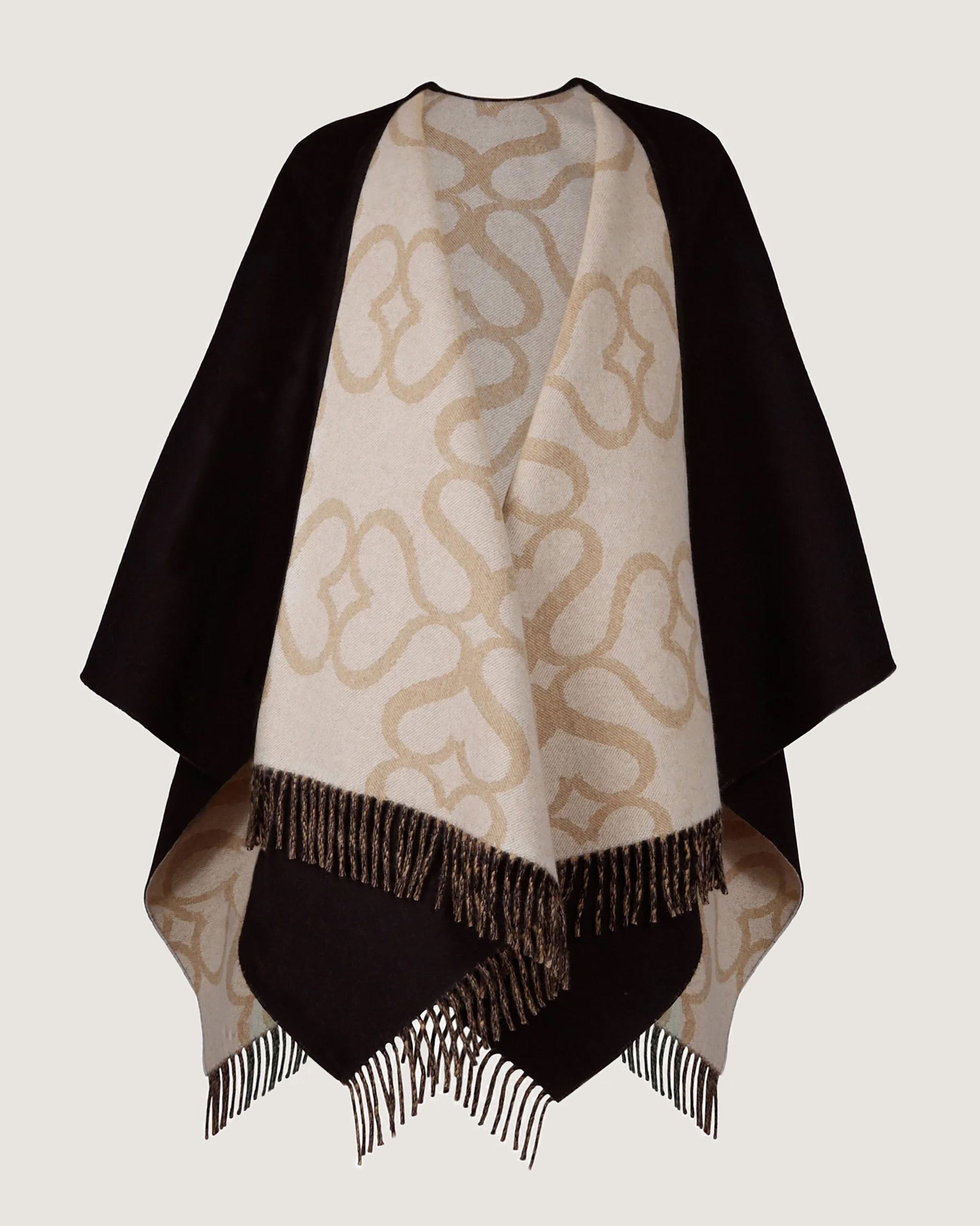 A white and black shawl with a design on it