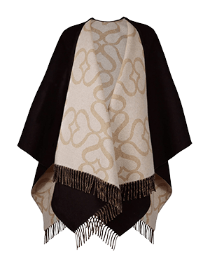 A white and black shawl with a pattern on it