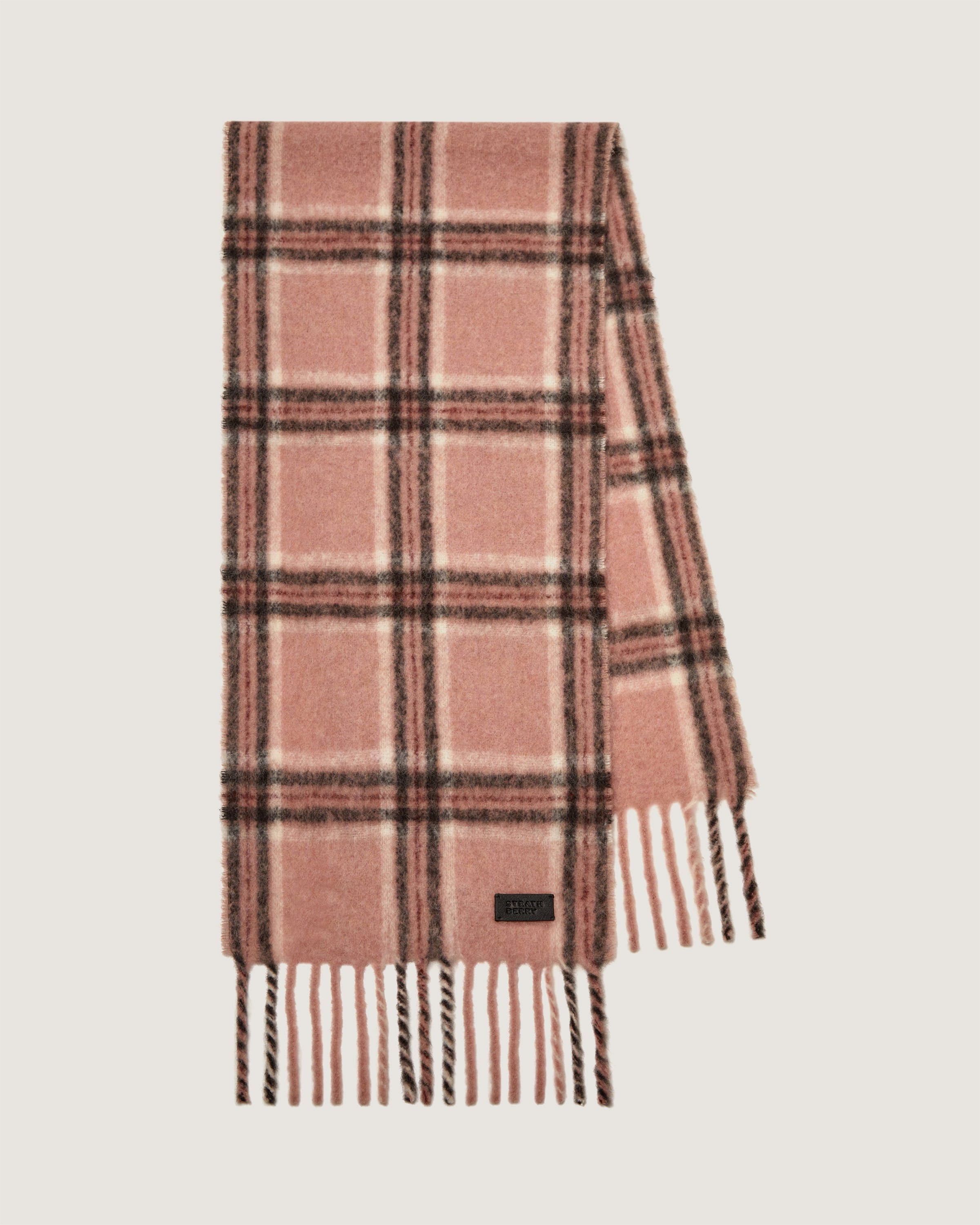 A pink and black plaid scarf on a white background