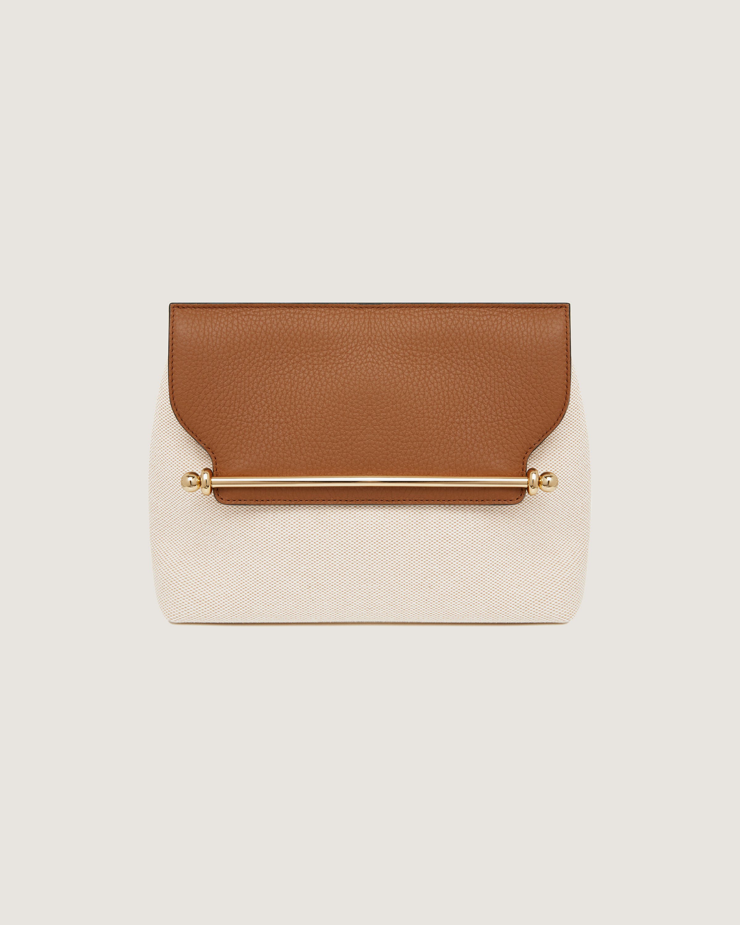 A brown and white clutch bag with a gold handle