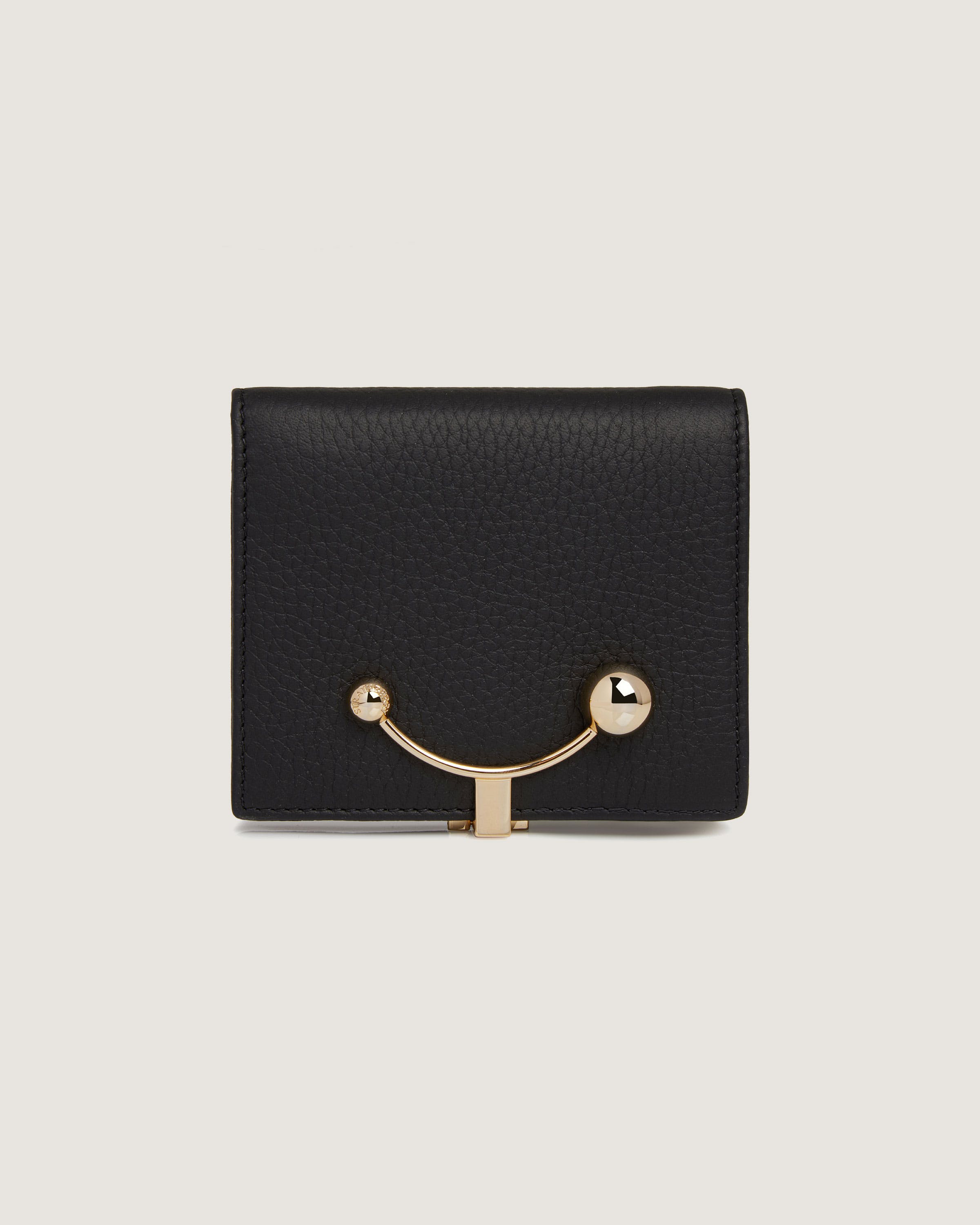 A black leather wallet with a gold metal handle