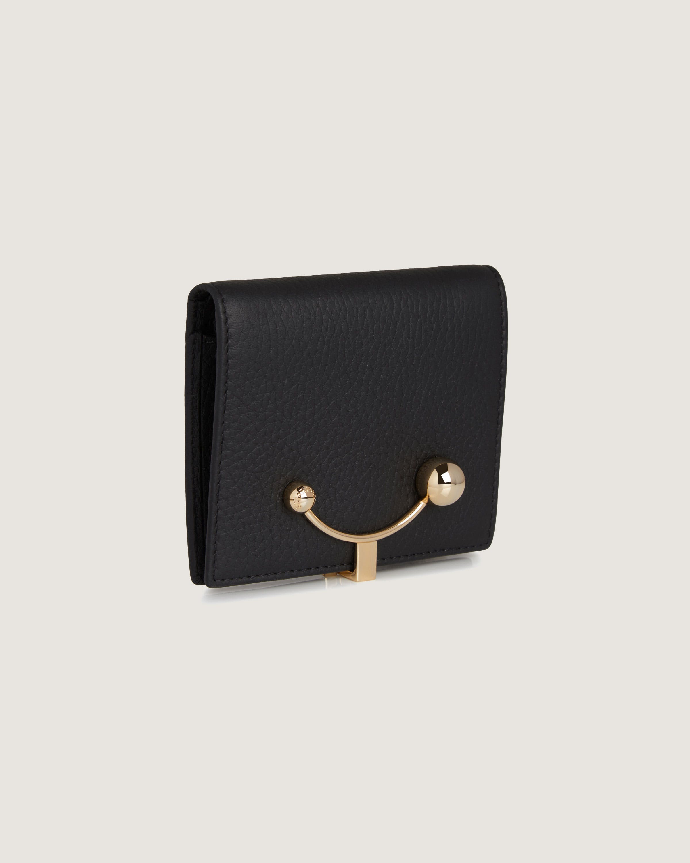 A black wallet with a gold handle