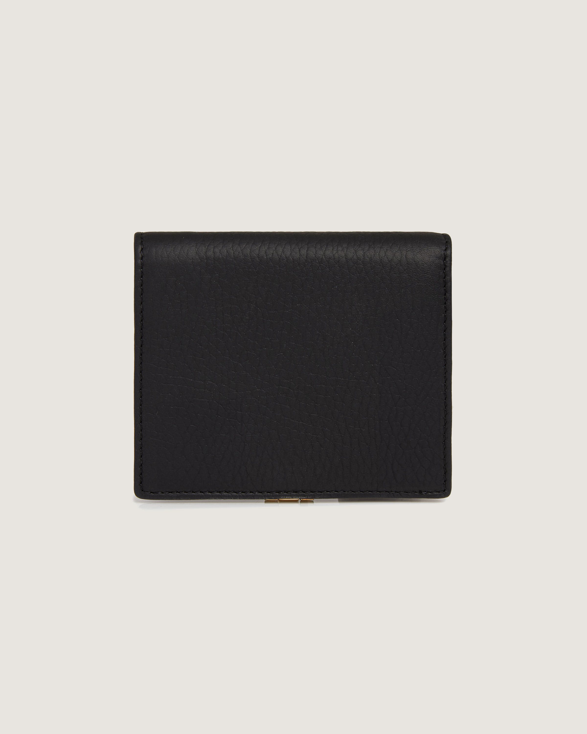 A black leather wallet on a white background