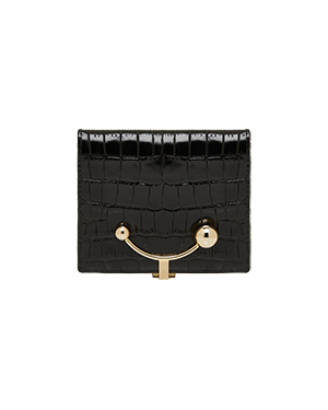 A black purse with a gold handle