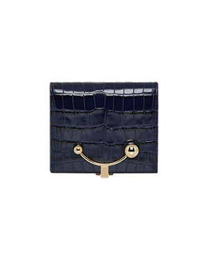 A blue alligator skin purse with a gold handle
