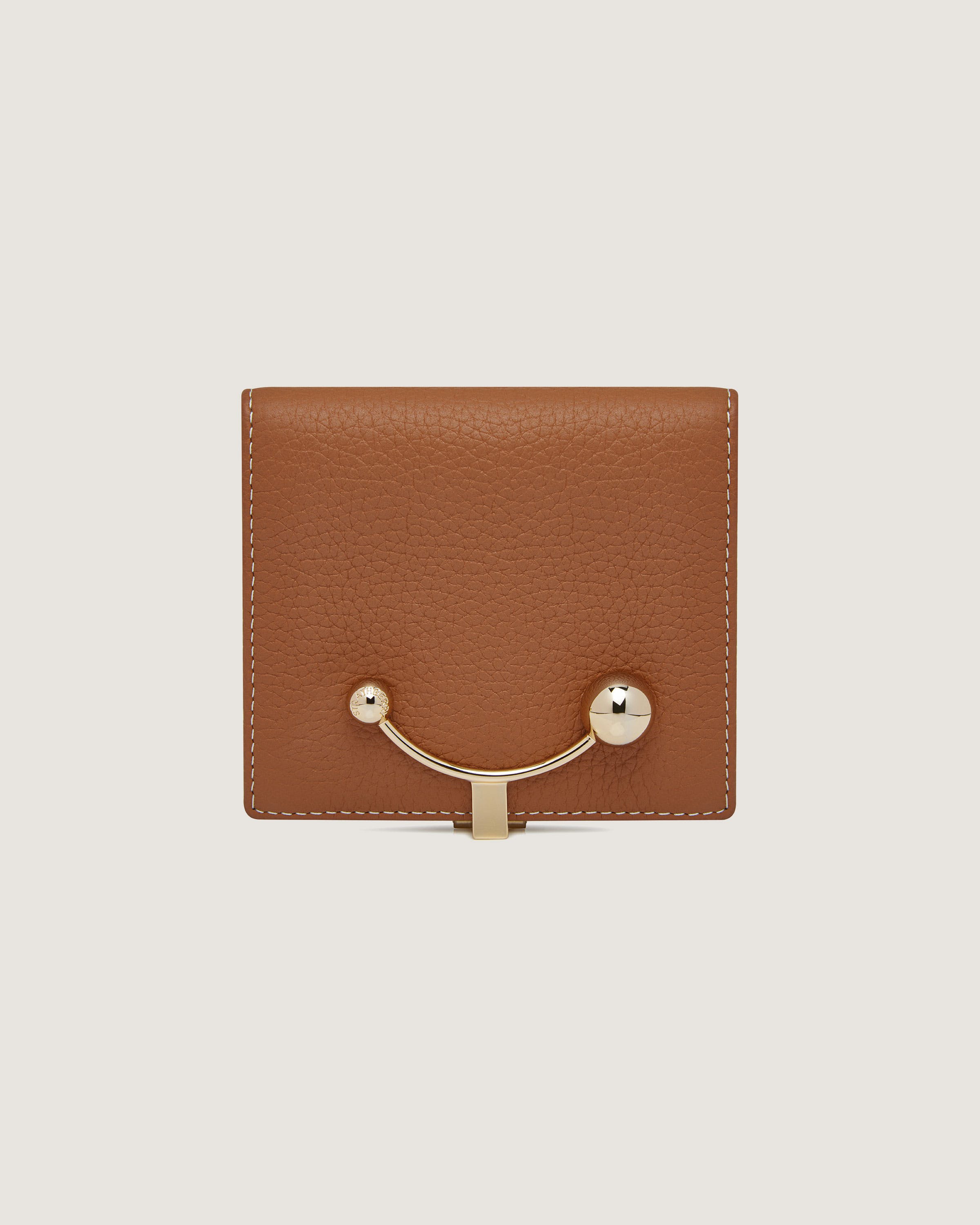 A brown leather wallet with a metal handle