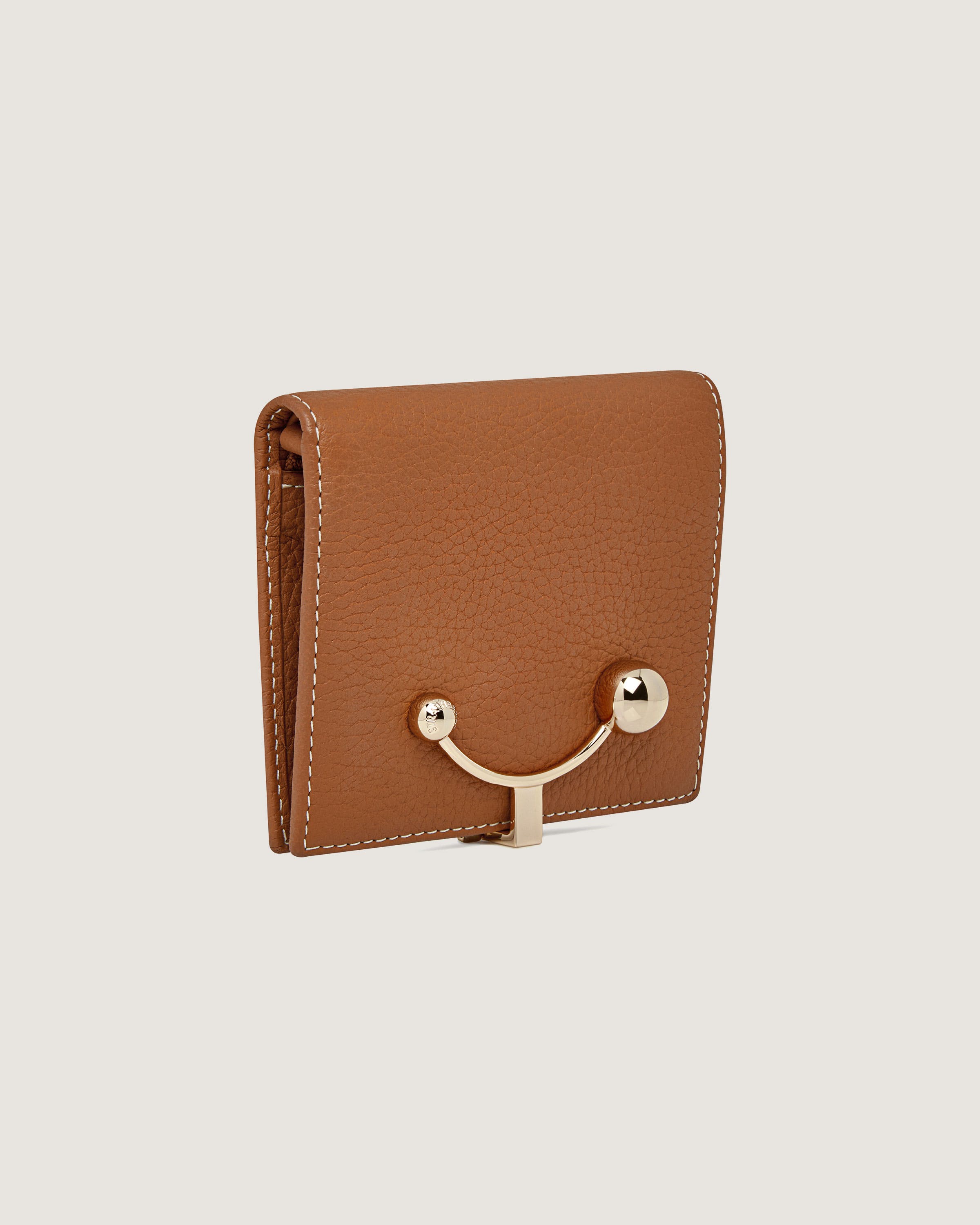 A brown leather wallet with a metal handle