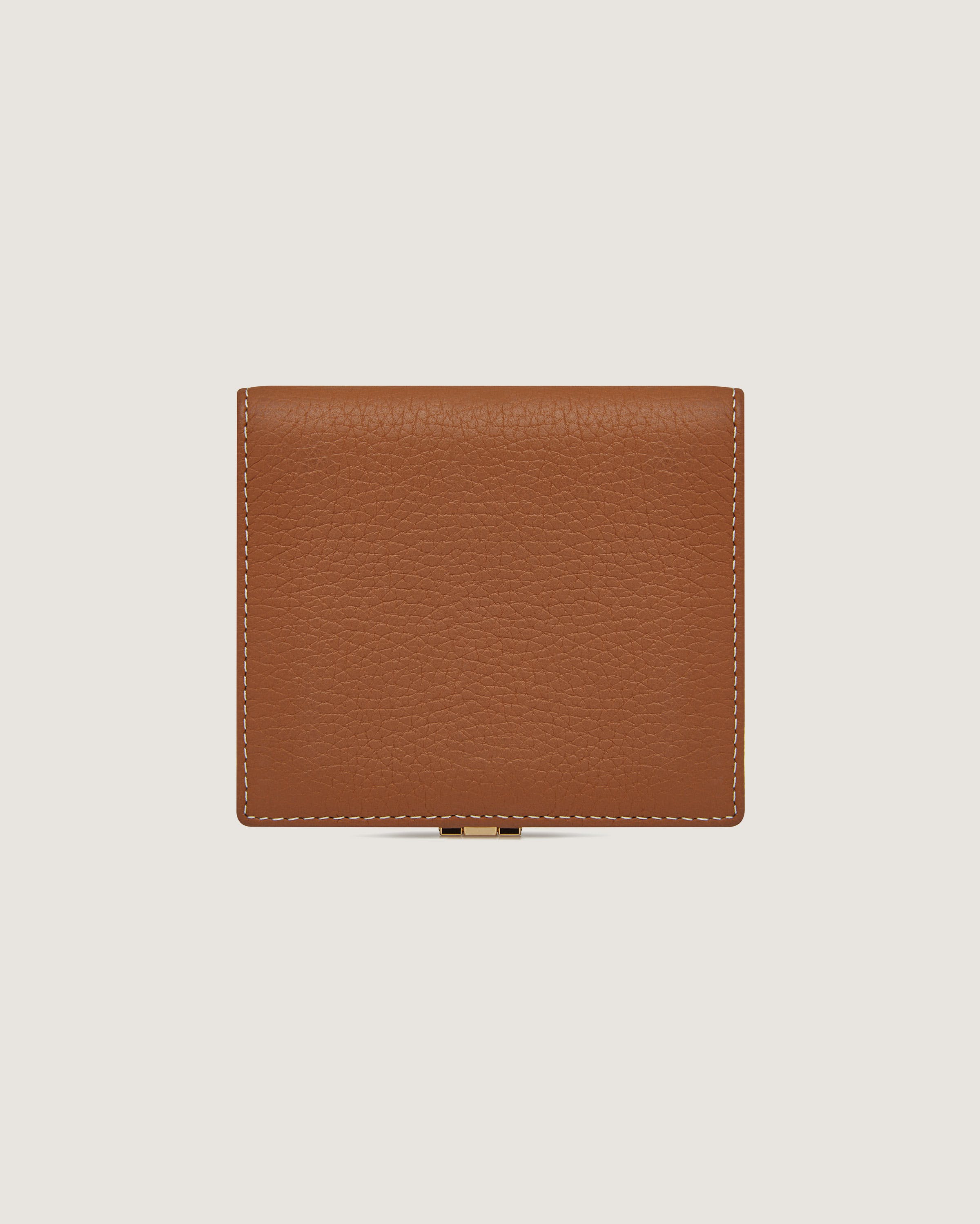 A brown leather wallet on a white background