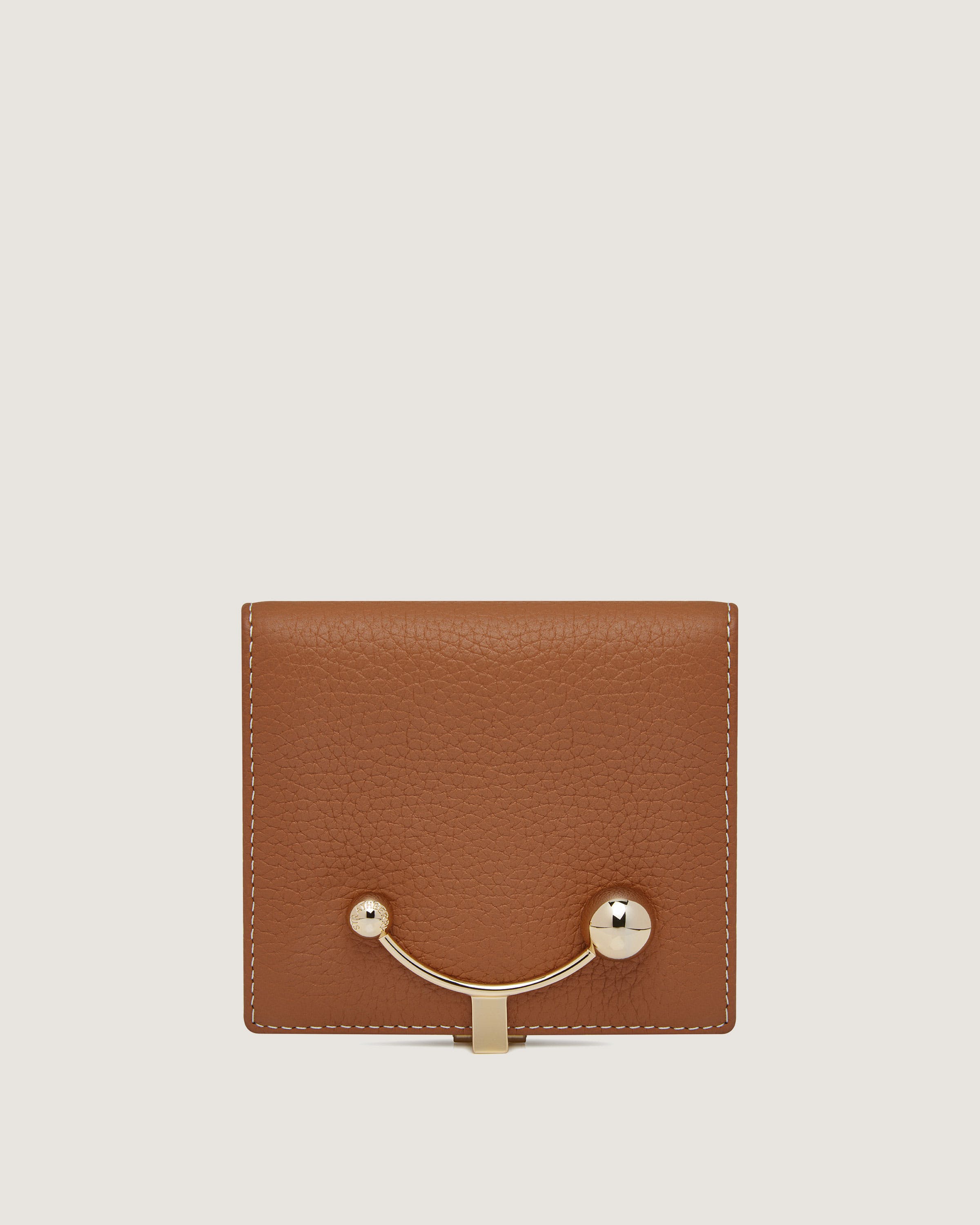 A brown wallet with a gold handle