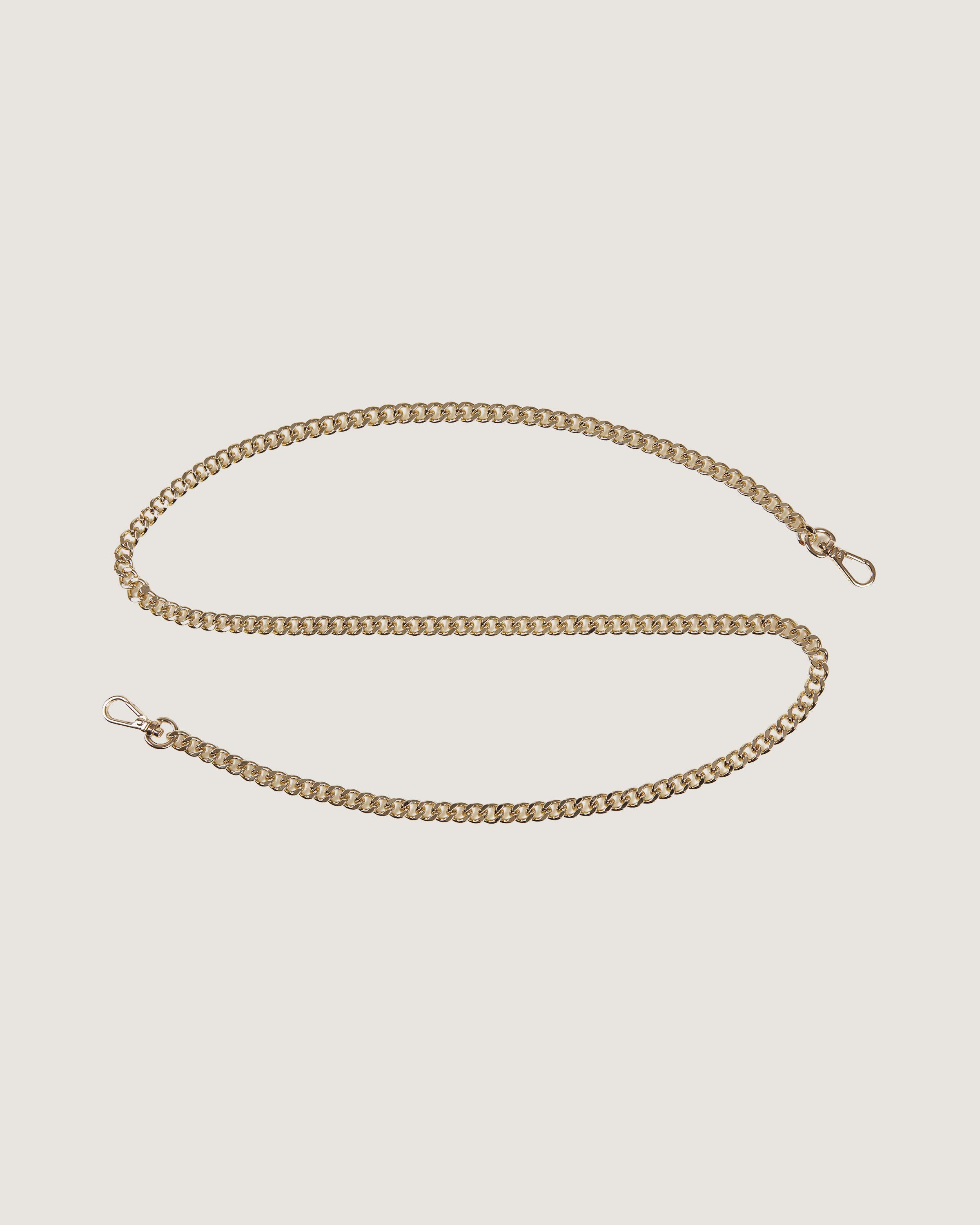 A gold chain on a white background