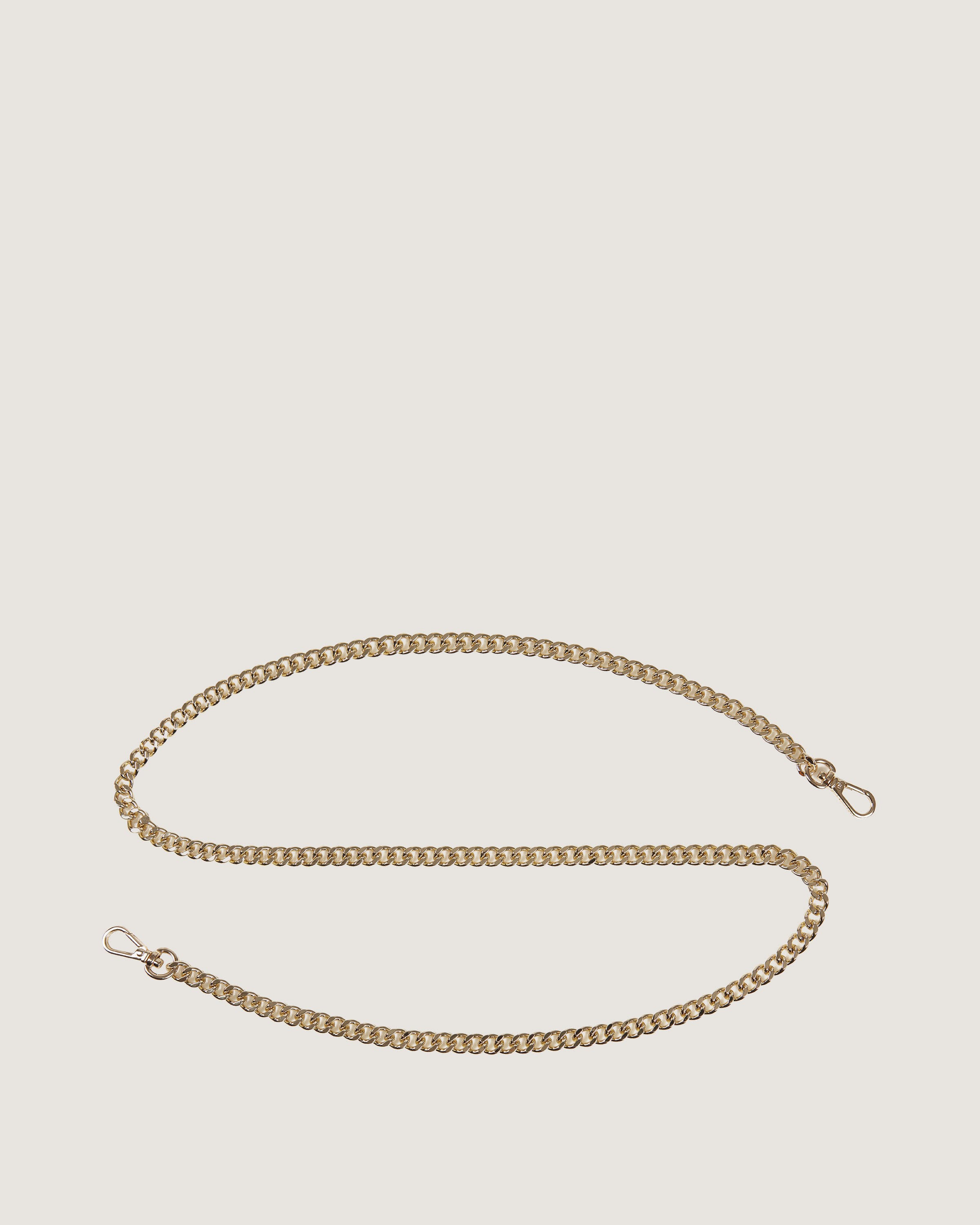 A gold chain on a white background