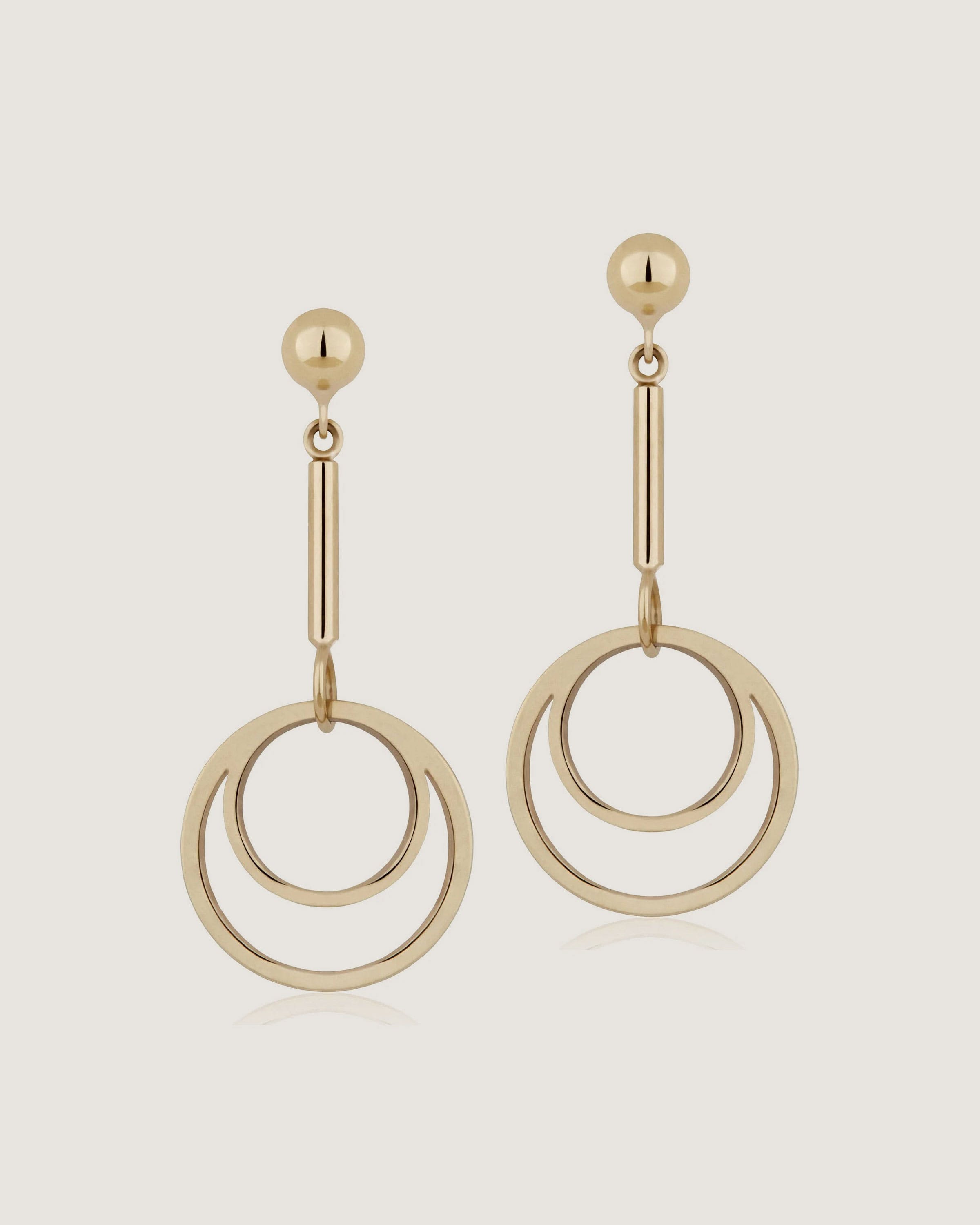 A pair of earrings with a circular design