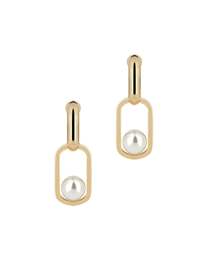 A pair of earrings with pearls on a green background