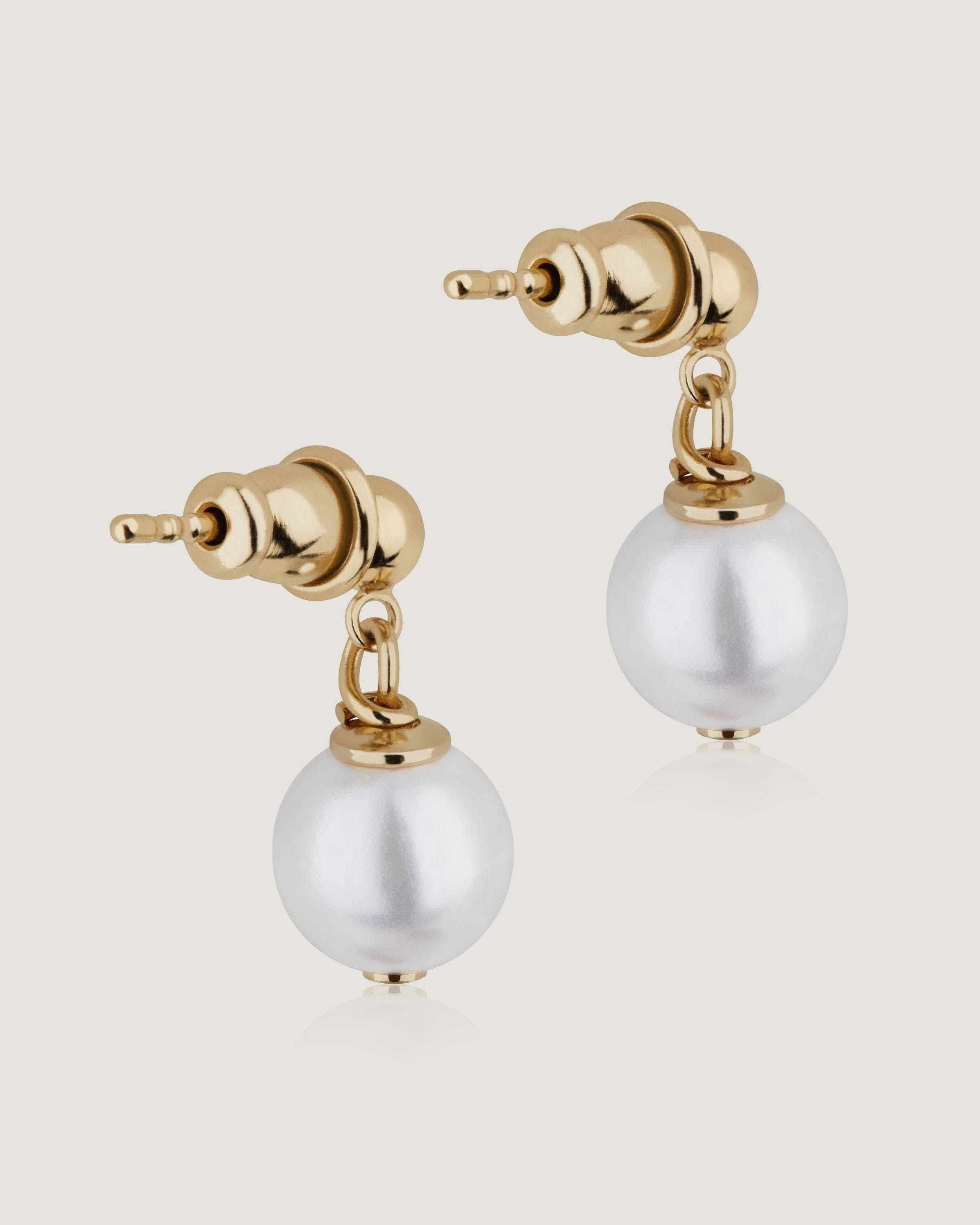 A pair of pearl and gold earrings