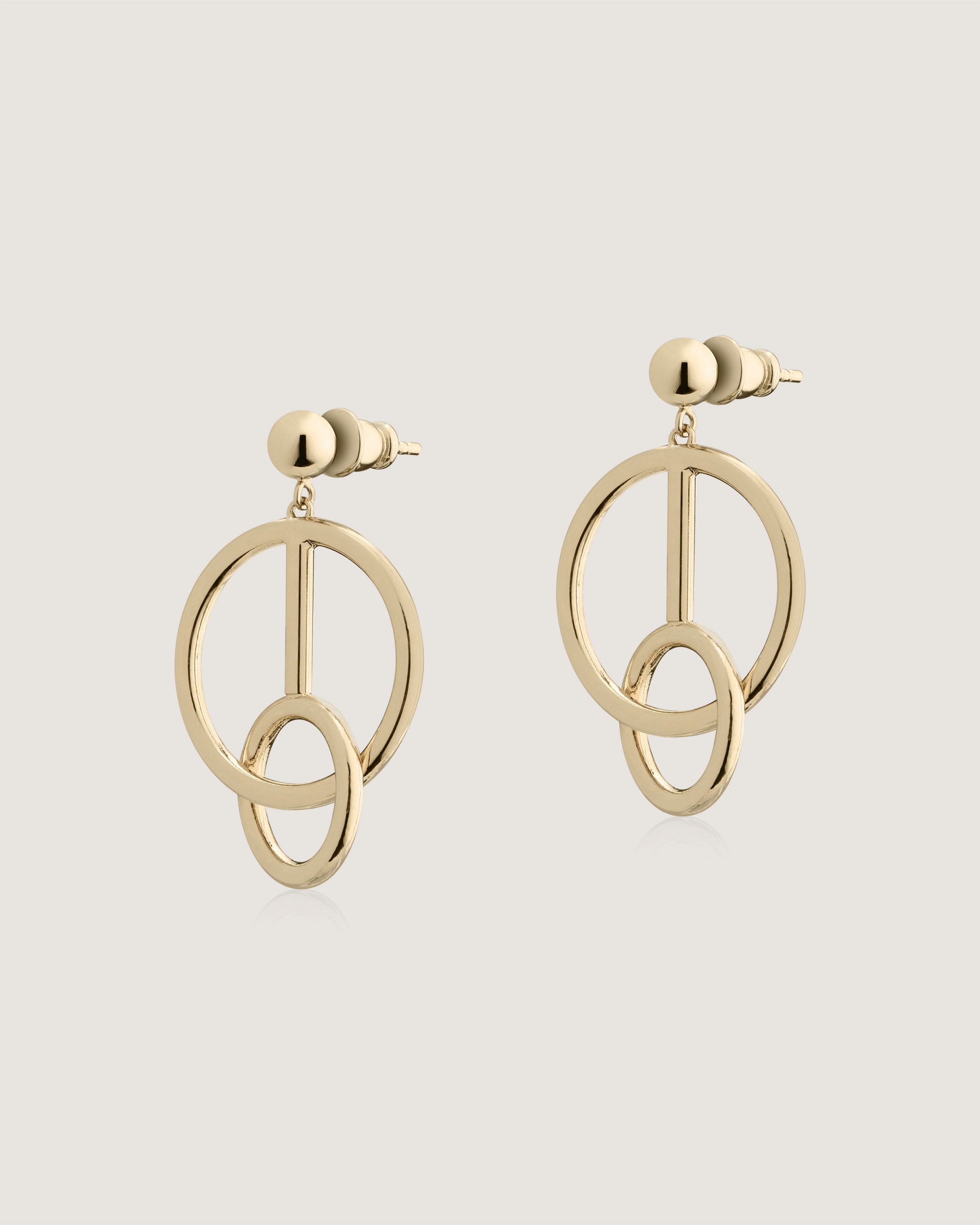 A pair of earrings with a circular design